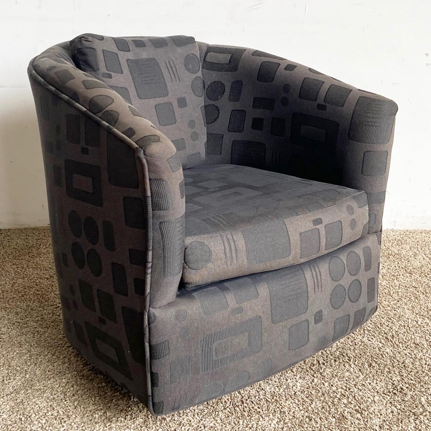 Immerse in the bold, luxurious allure of our Postmodern Black Swivel Barrel Chair. A perfect blend of comfort, style, and postmodern design.

Luxurious black fabric combined with an unconventional postmodern design.
Sculpted barrel silhouette with a