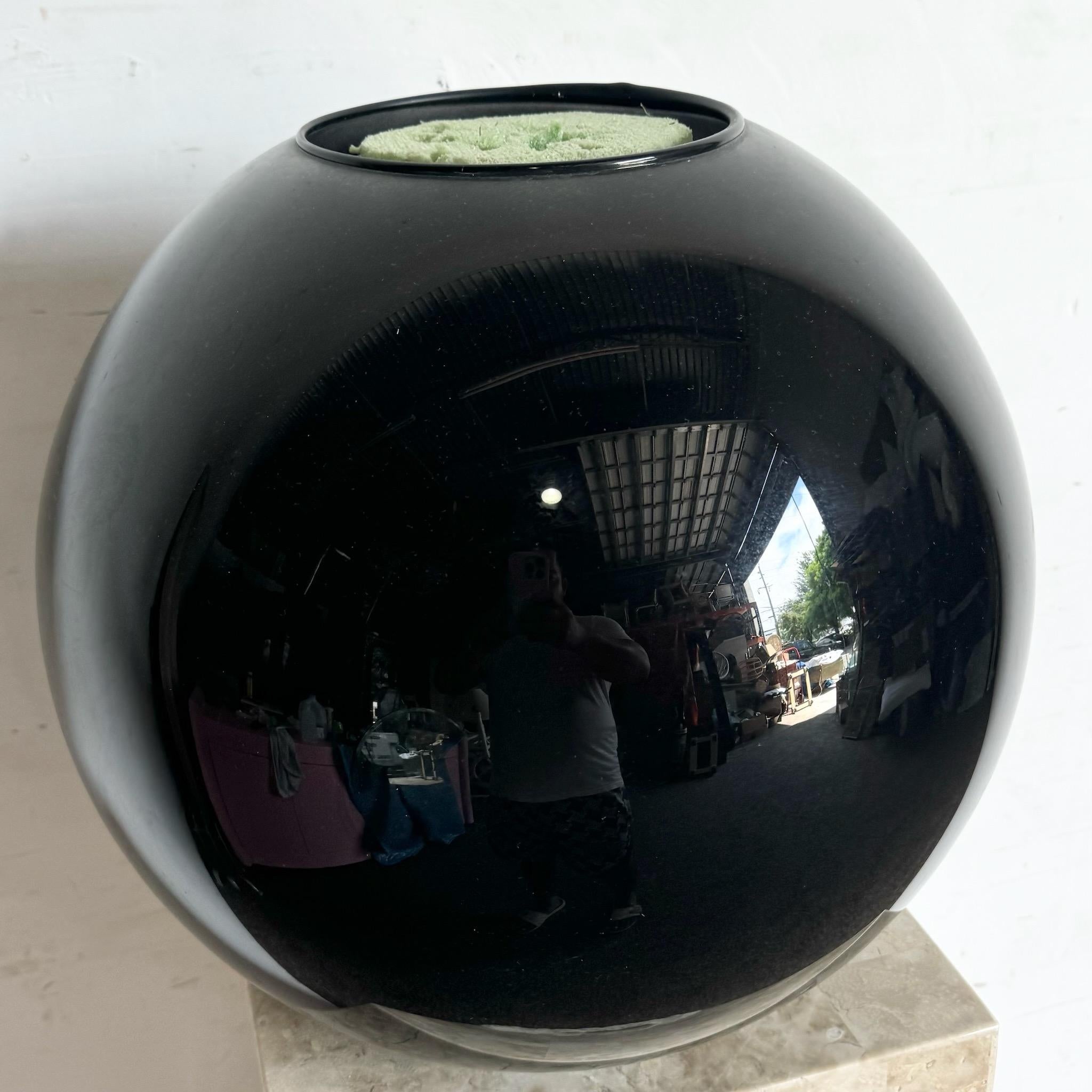 Add a touch of modern sophistication to your decor with this postmodern black glass ceramic spherical vase. Featuring a sleek, glossy finish and a unique spherical design, this vase is perfect for creating a bold, contemporary statement in any