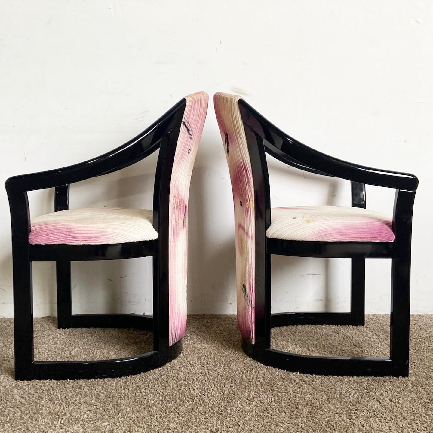 Introducing this set of four Post-Modern Postmodern Black and Pink Arm Chairs. Blending vibrant color with sleek design, these chairs are a statement piece for any modern interior.
Some wear around the edges as seen in the photos.