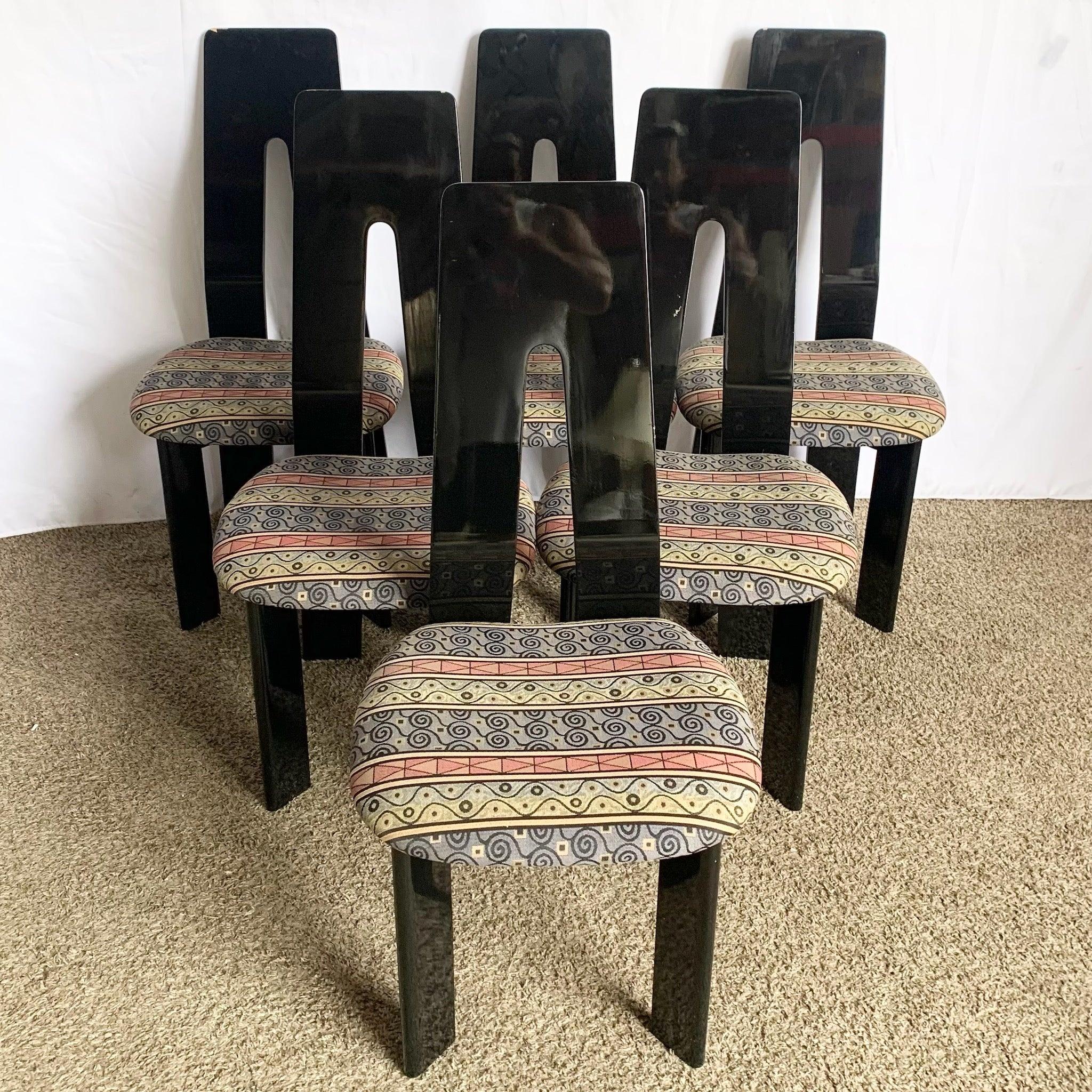 Postmodern Black Lacquer Dining Chairs set of six—glossy high‑back silhouettes, sculptural form, and vintage Italian craftsmanship for a bold dining statement.
 

 Wear to the finish around the edges and surfaces as shown in the photos. 
 

 We sell