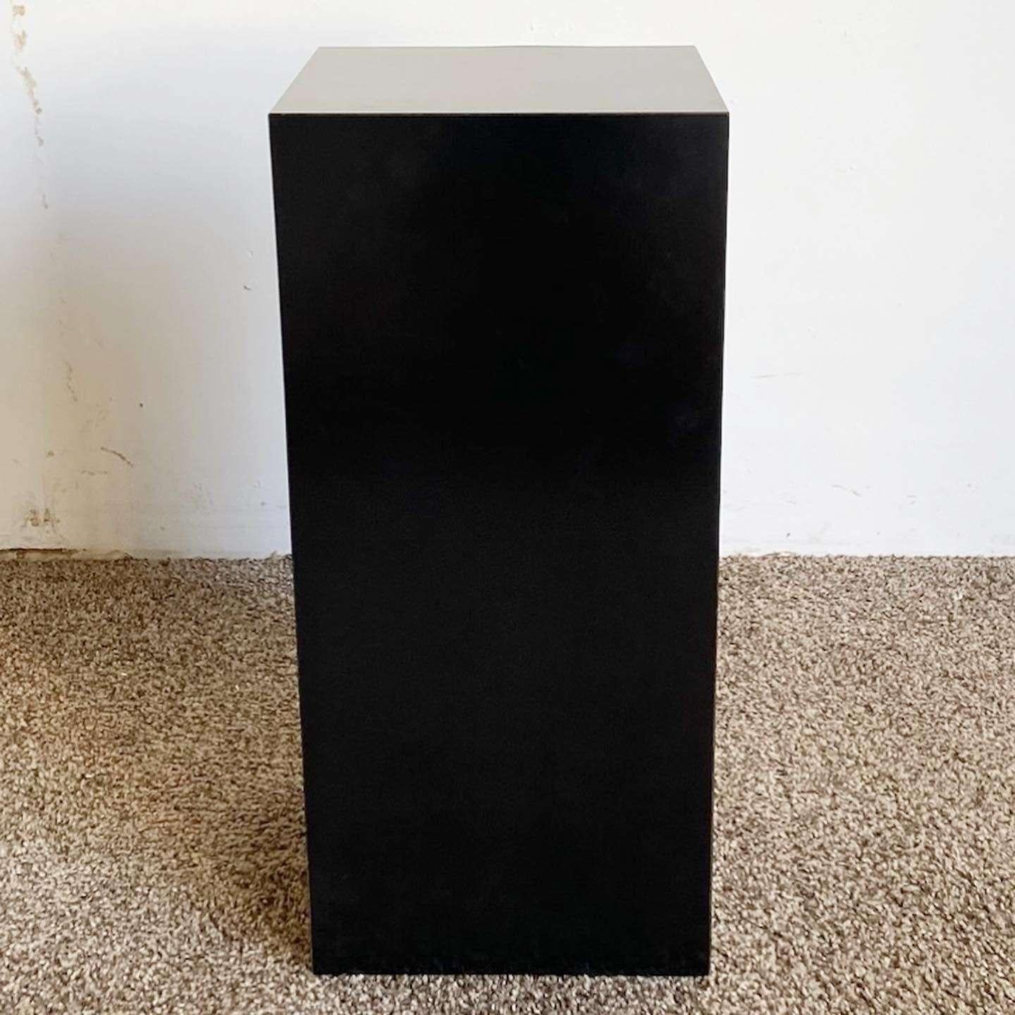 Exceptional vintage postmodern rectangular pedestal/side table. Features a black lacquer laminate.
