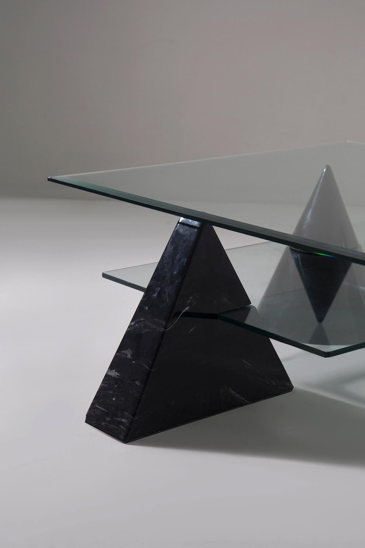 
This extraordinary coffee table, made of black marble in the 1970s-early 1980s, embodies the refined and conceptual aesthetics of Italian postmodern design. Its style recalls the purity of geometric forms and the design approach of Massimo