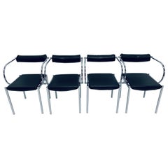 Postmodern Black Naugahyde and Chrome Dining Chairs, Set of Four