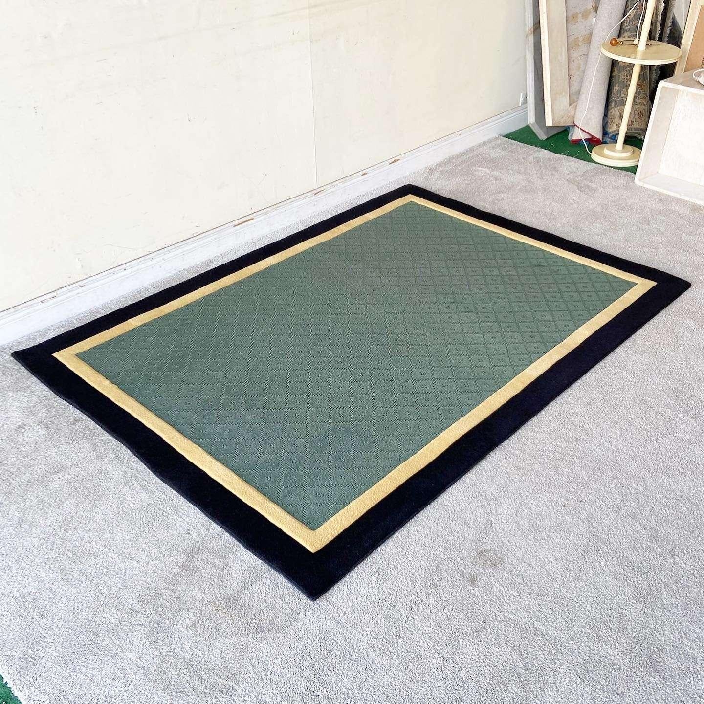 Amazing vintage postmodern rectangular area rug. Features a dark hunter green center border by a tan and and black section.

Rug 2
