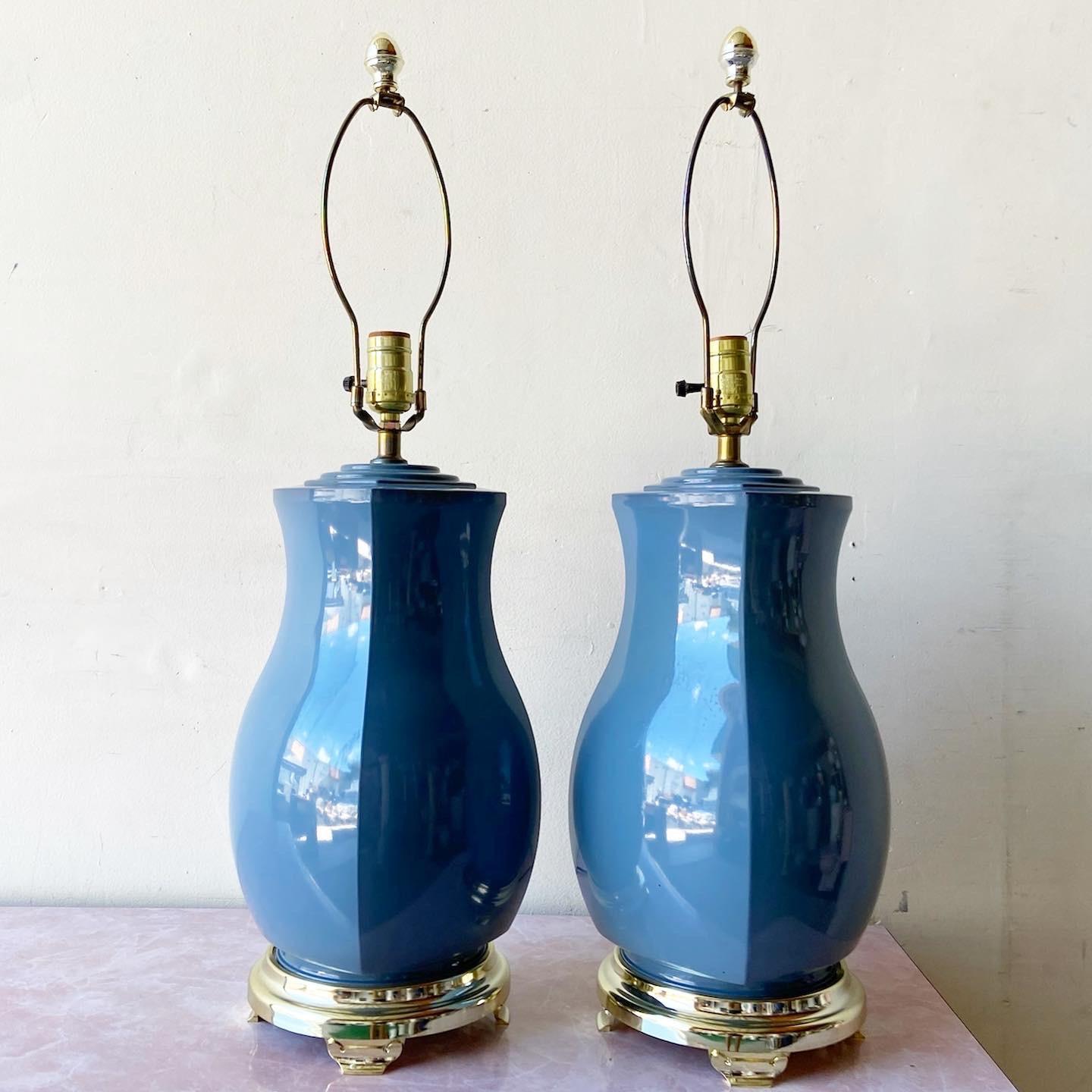 Stunning pair of postmodern porcelain table lamps. Body displays a 4 sided blue gloss.

3 way lighting
