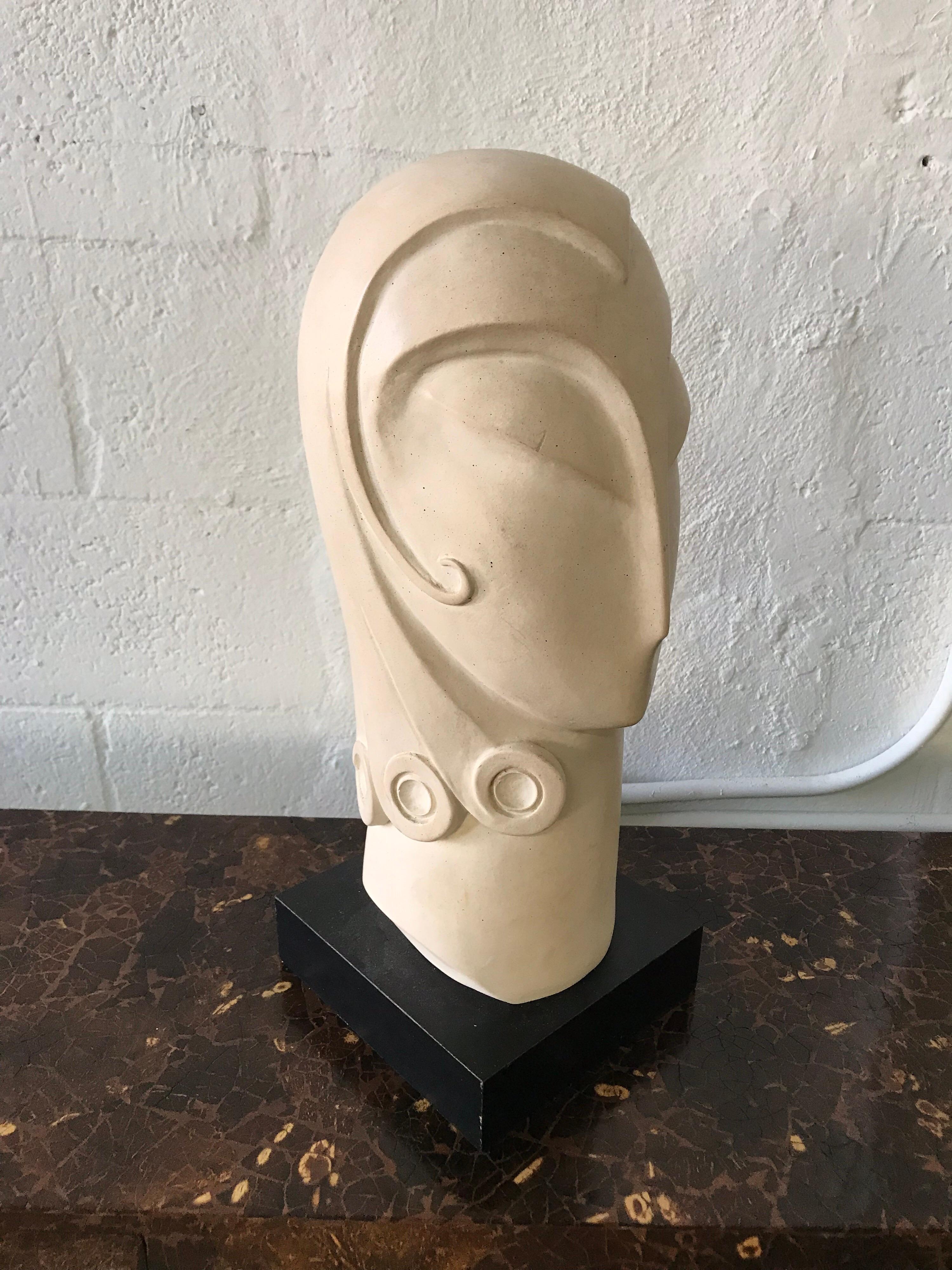 Postmodern plaster resin head bust sculpture in the style of Brancusi by Austin Productions Signed Fisher, 1995.