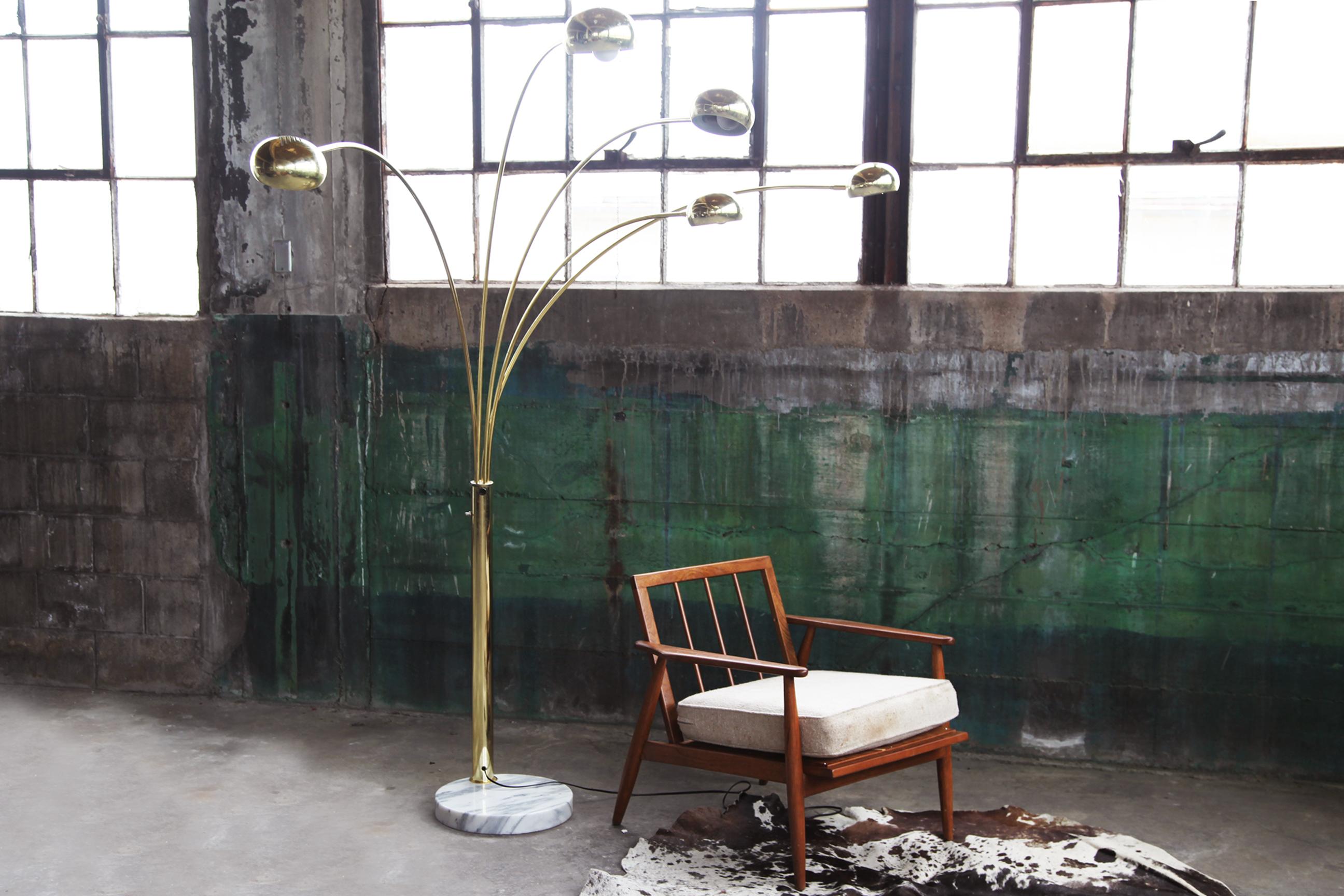 Beautiful, adjustable 5 arm Brass arc lamp with a Carrara marble base, circa 1970s.

Puts out great light, and looks excellent with a Postmodern, Mid Century and Modern decor.

Height: 80 in. (203.2 cm)
Width: 60 in. (152.4 cm)
Depth: 15 in.