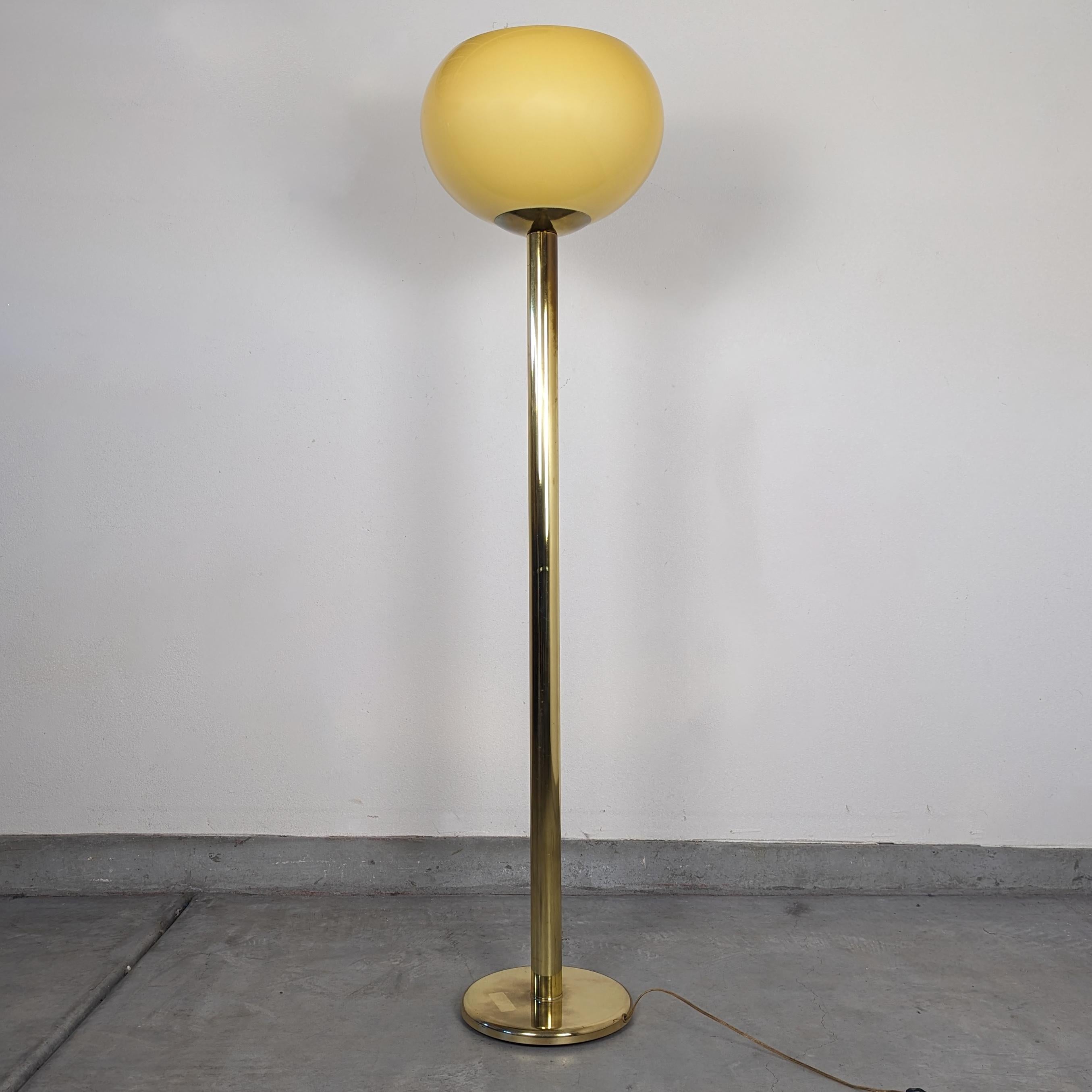 Step back in time and illuminate your space with the timeless elegance of this vintage brass floor lamp by the esteemed Rainbow Lamp Company, circa 1980s. Standing at an impressive 61 inches tall, this lamp boasts a slender profile body that exudes