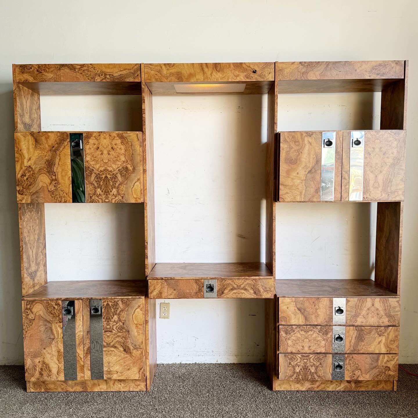 Embrace the innovation of postmodern design with this Burl Wood Laminate and Chrome Etagere with Floating Desk. Featuring two etageres for storage and display, one revealing a stylish bar and the other equipped with cabinets and drawers, this piece