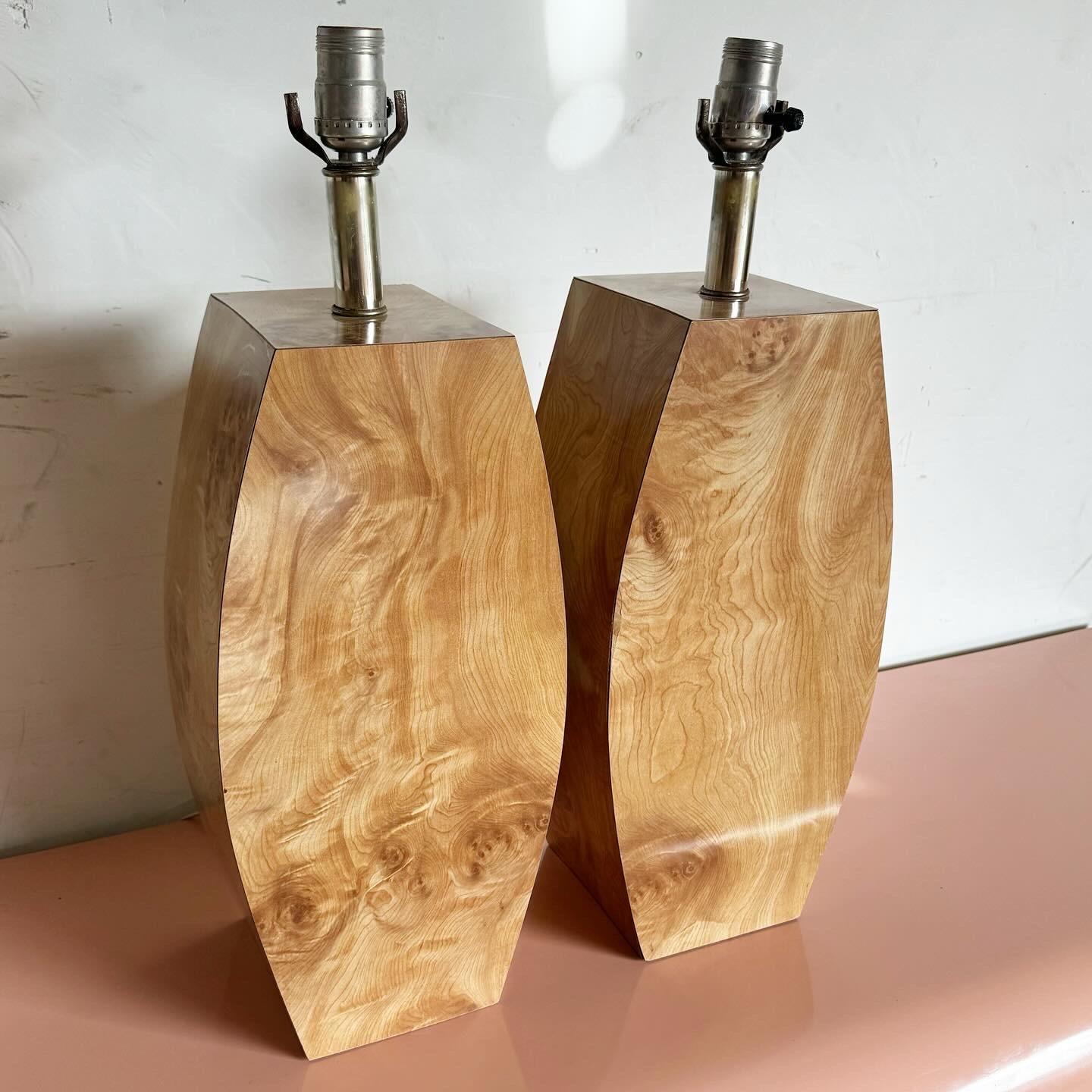 Elevate your decor with this pair of Postmodern Burl Wood Laminate Table Lamps, blending the unique beauty of burl wood with a contemporary design. Perfect for adding warmth and a modern touch to any space, these lamps serve as both ambient lighting