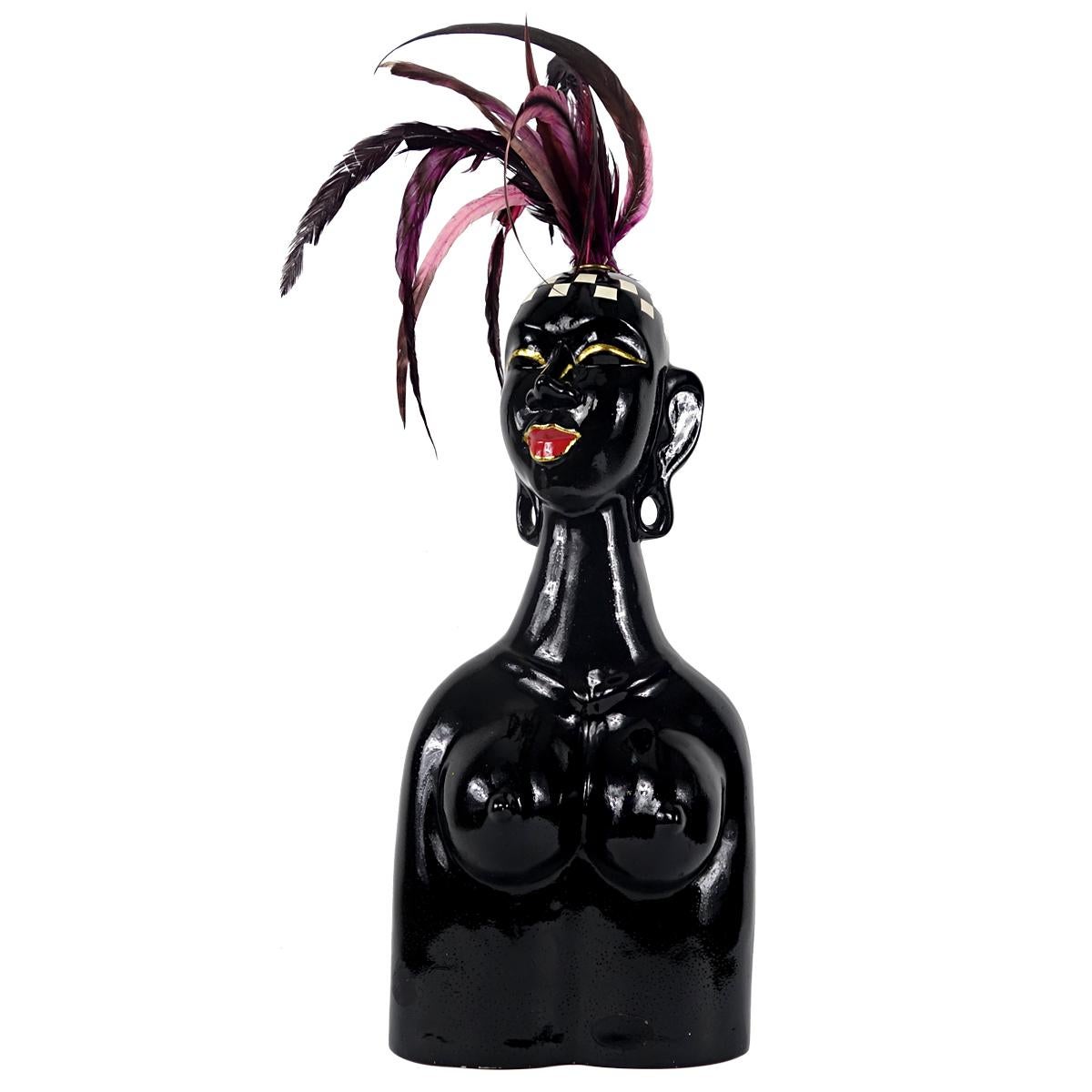 This black bust most probably depicts Josephine Baker, the great French American-born performer.
This woman seems to have just stepped out of the Folies Bergères where she once again caused a sensation.
This bust is made of resin and probably