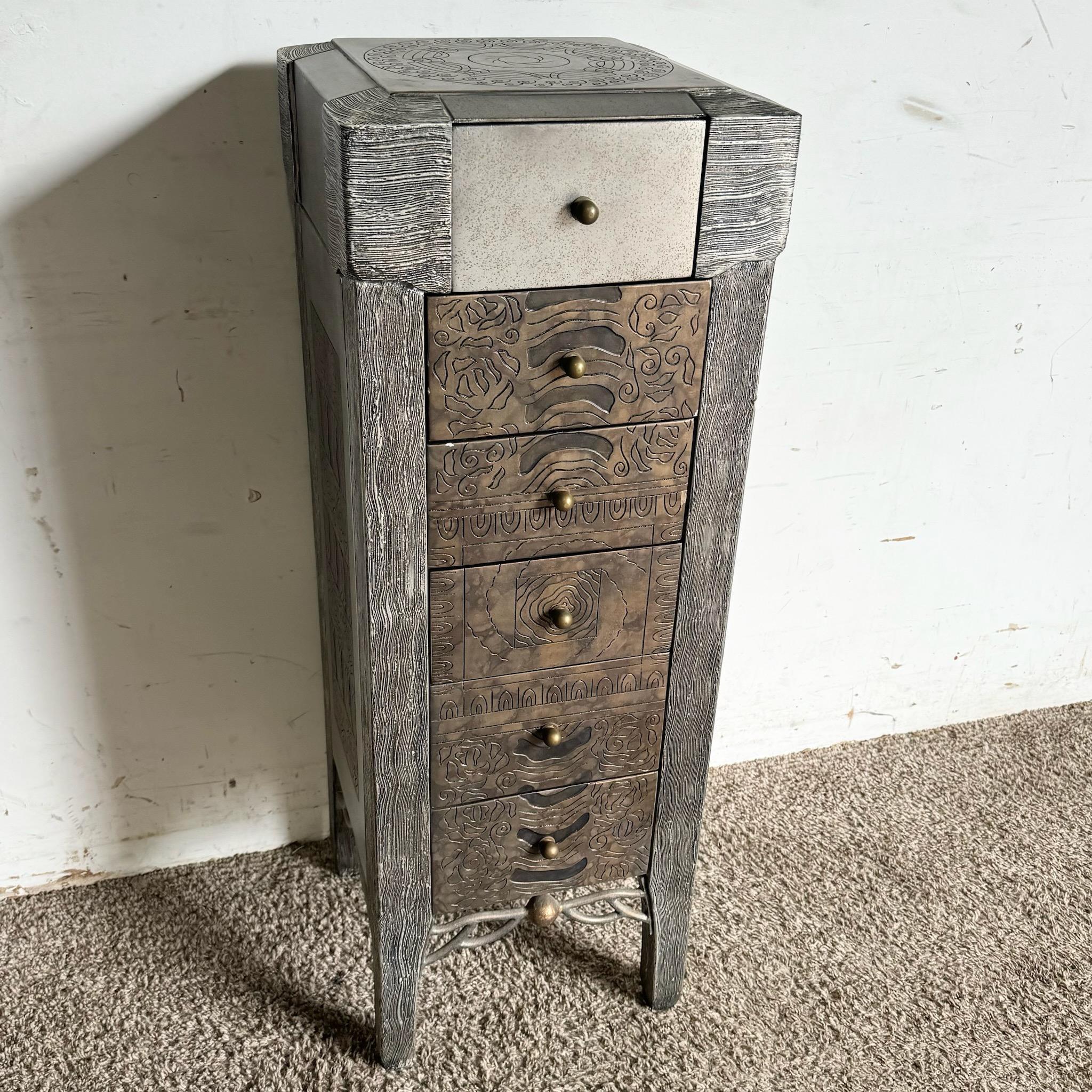 This Postmodern Carved Jewelry Chest/Lingerie Armoire blends artistry and function, featuring intricate carved detailing and a tall, striking design. With multiple drawers for organizing jewelry, lingerie, or other personal items, it offers both