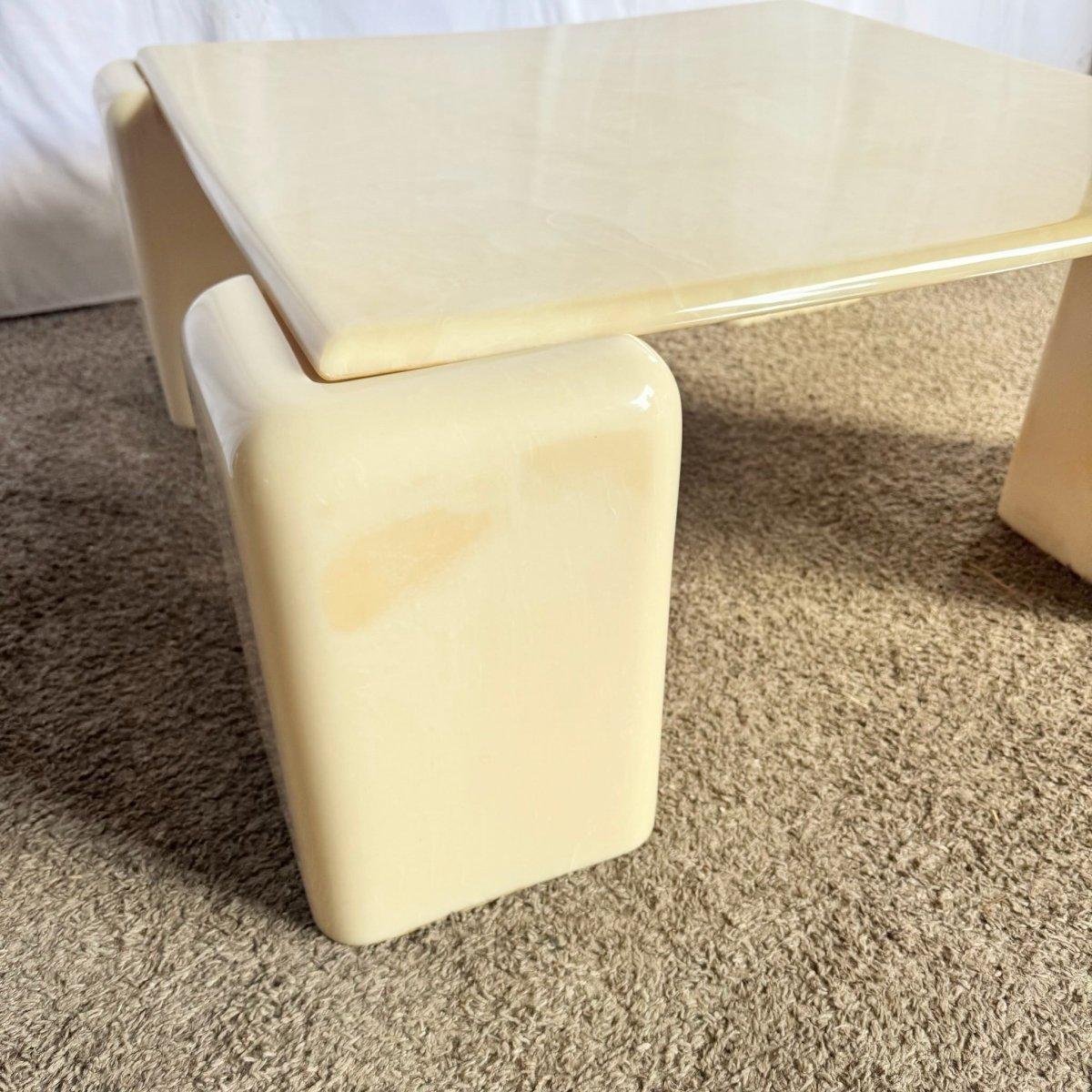 Postmodern Cast Faux Cream Marble Coffee Table delivers sculptural cream elegance and modern flair as a luxurious focal point for upscale living spaces.
 

 Some bowing to the table top from time as shown in the photos.
 

 We sell items as