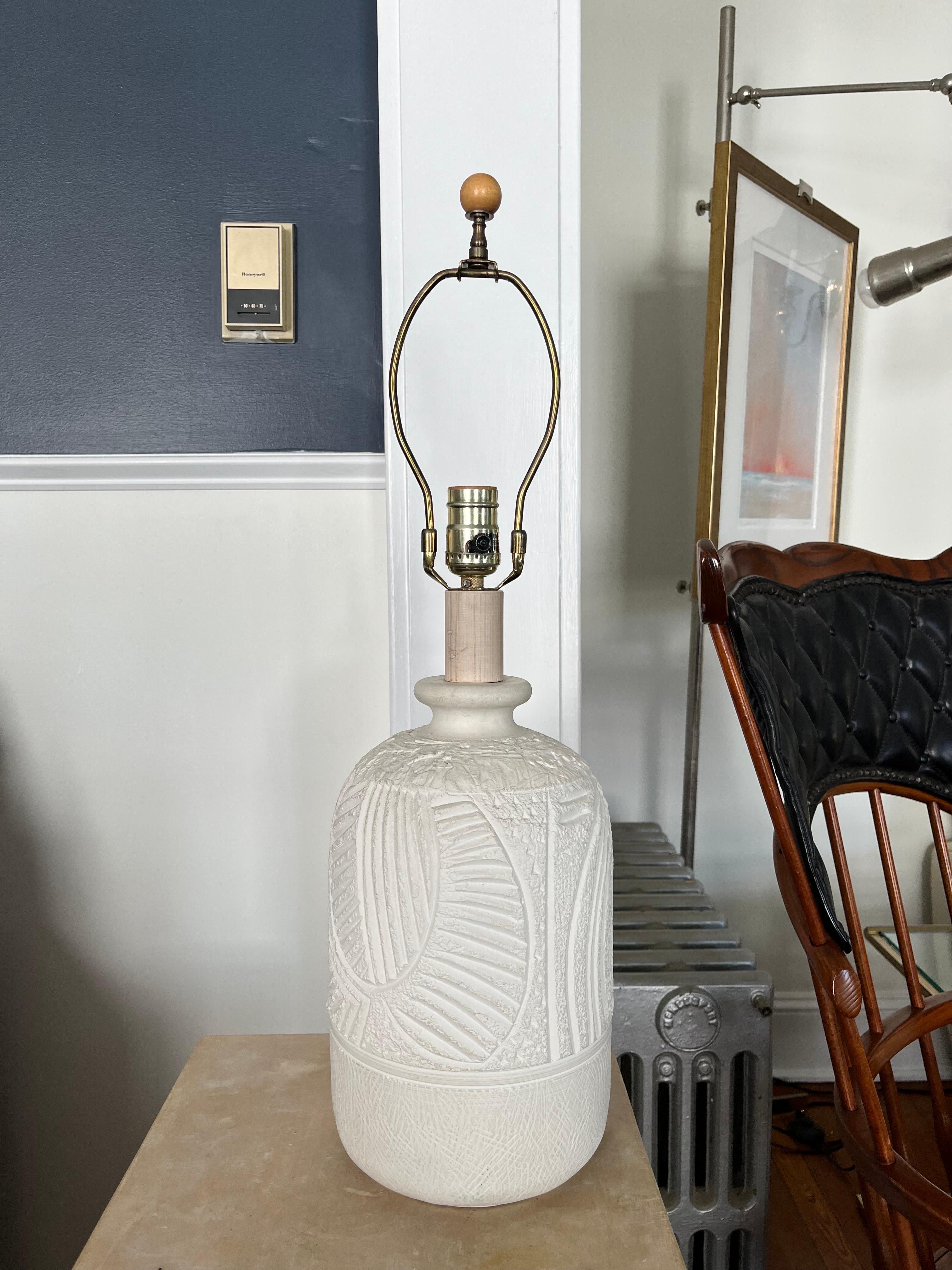 Nicely detailed ceramic lamp by Casual Lamps of California. Deeply carved with geometric design. Unique in its Size and shape.