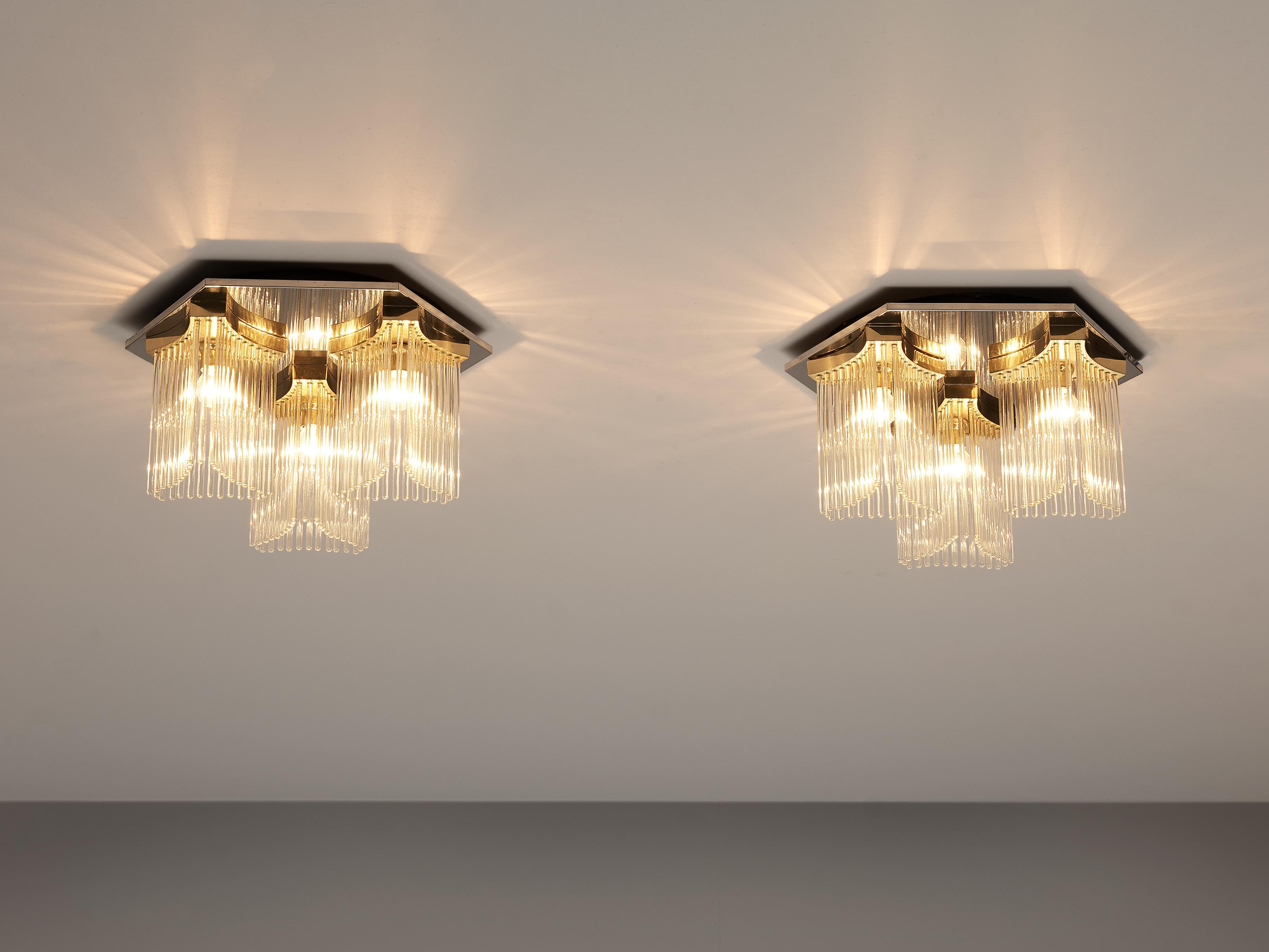 Gaetano Sciolari ceiling lights, glass, metal, Europe, 1980s

On a polygonal ceiling fixture are three light bulbs adjusted. These are surrounded by long glass sticks adjusted in wonderful shape. The light which shines through the separated glass