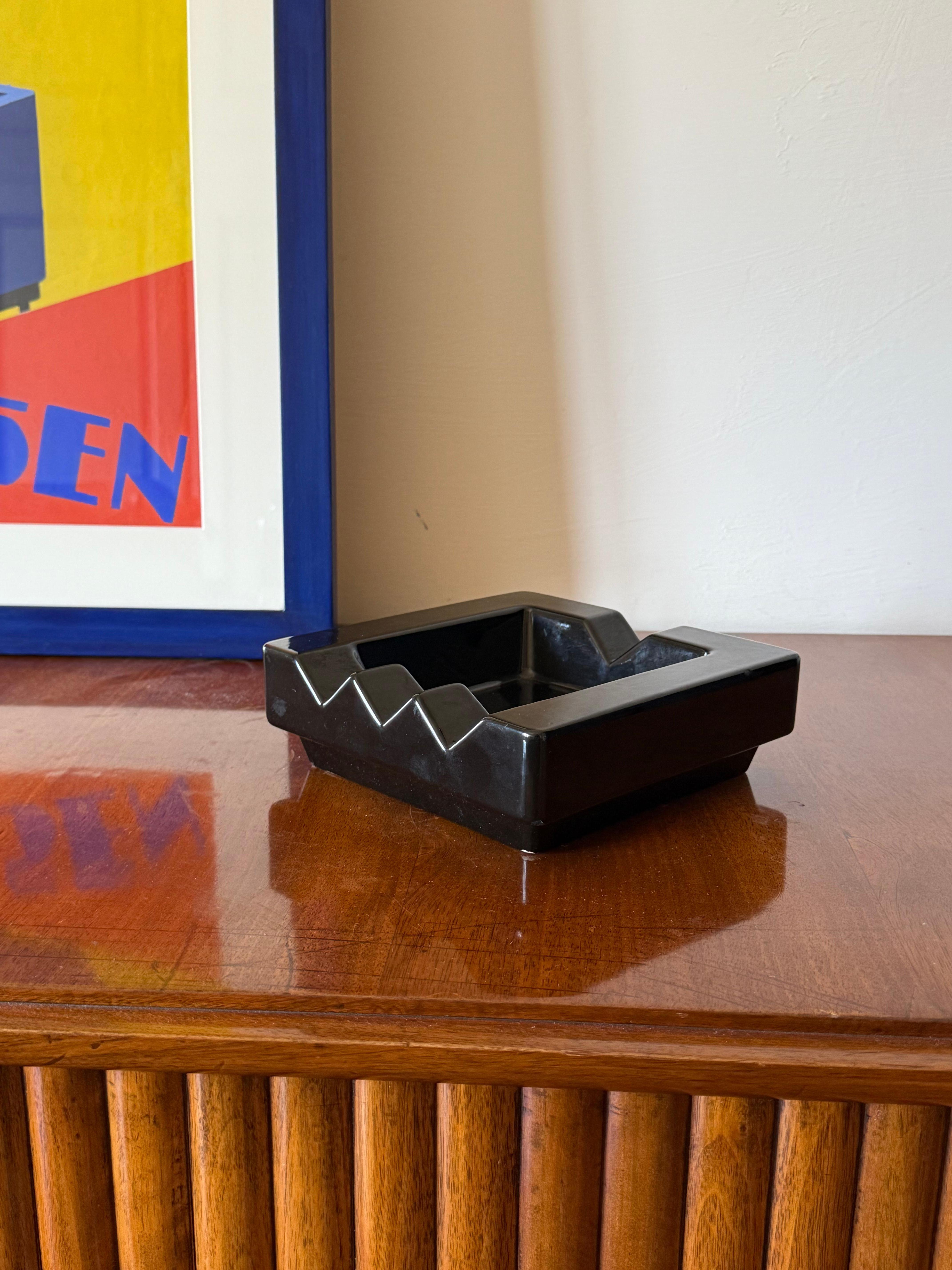 Postmodern black ceramic ashtray

in the manner of Ettore Sottsass, the Mambruco, Italy 1970s

Black glazed ceramic

labelled The Mambruco

h: 6.5 cm - 19 × 19 cm

Conditions: excellent, consistent with age and use