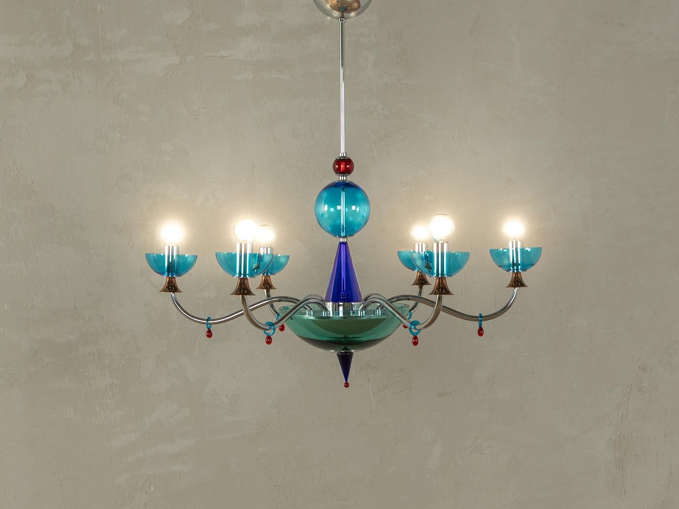Postmodern chandelier in the style of Gio Ponti from the 1980s. High quality metal frame with glass elements made of Murano glass in shades of blue, red and green.
Quality Features:

    accomplished design: perfect proportions and visible attention