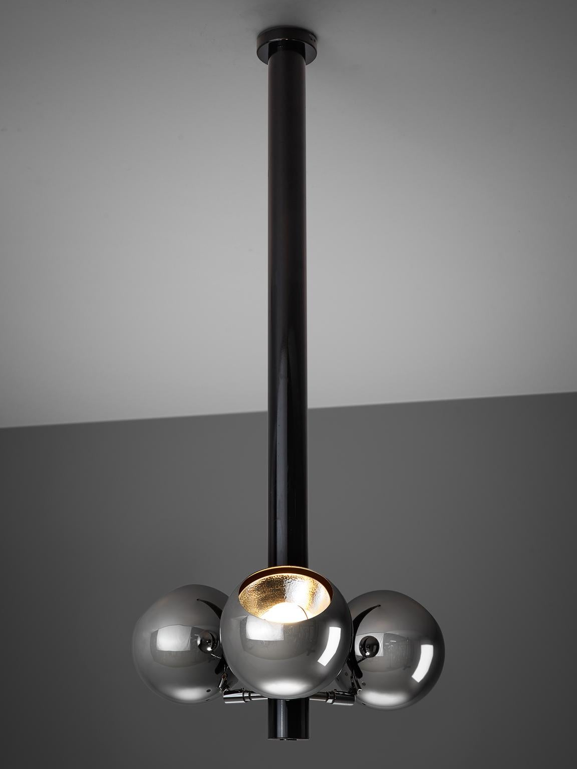 Chandelier, chromed and black metal, Italy, 1970s.

This unusually long chandelier is designed in the 1970s. The chandelier has space age like spheres that point upwards. These clean, sleek chrome spheres fit well with the long black stem. The piece