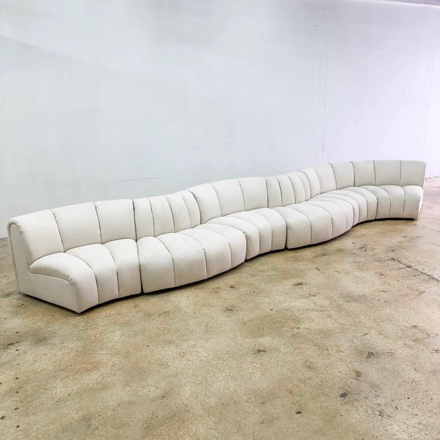 Postmodern Channeled Scalloped Beige Sofa delivers luxurious sectional comfort and elegant curves, perfect for upscale modern living spaces.
 

 Some discoloration to the fabric as can be seen in the photos.
 

 We sell items as acquired, without