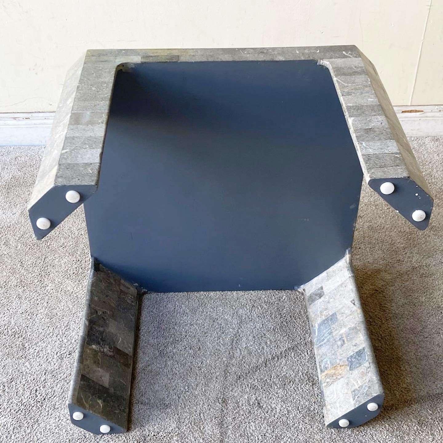 Exceptional vintage postmodern tessellated stone side table. Features charcoal polished stone throughout with a beige border around the top.