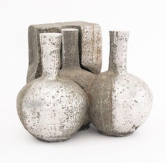 Escultura postmoderna de acero cromado en dos piezas