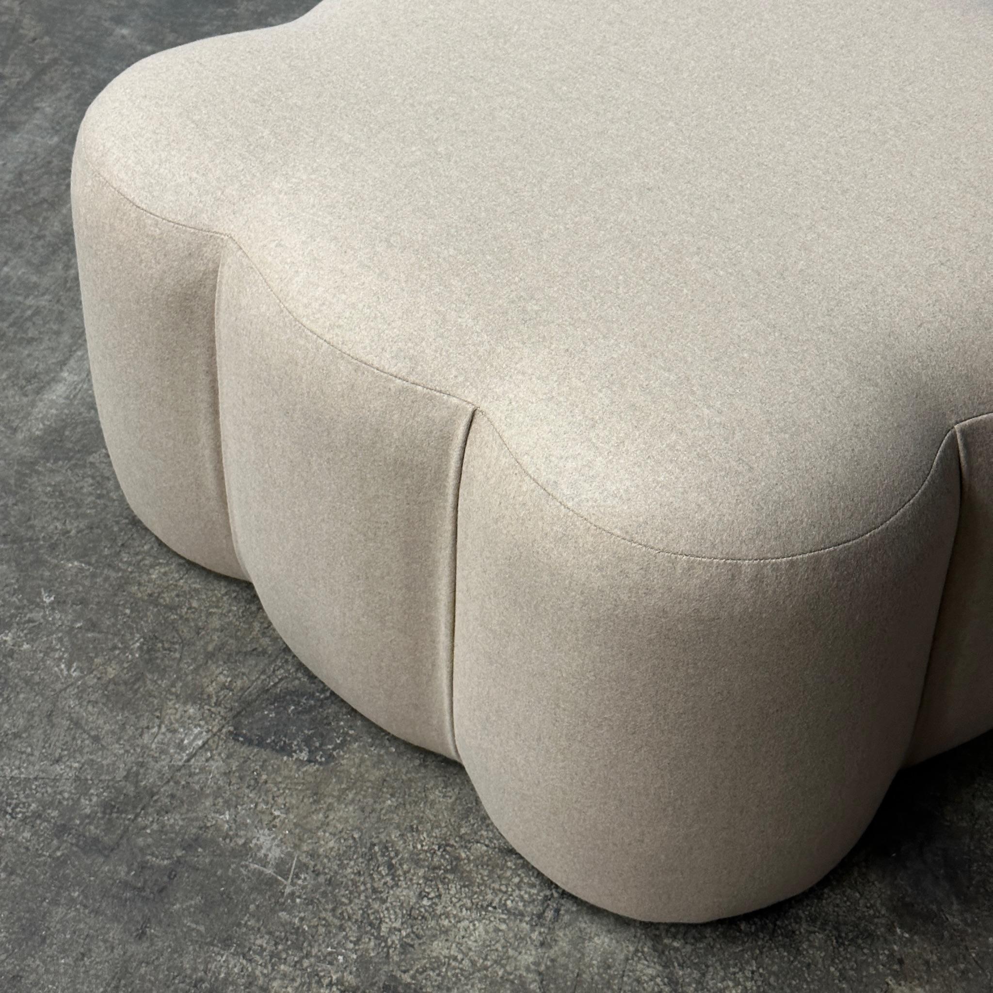 Reupholstered in peachy beige Kvadrat fabric. Perfect as a statement piece or as an accessory to a lounge chair. 