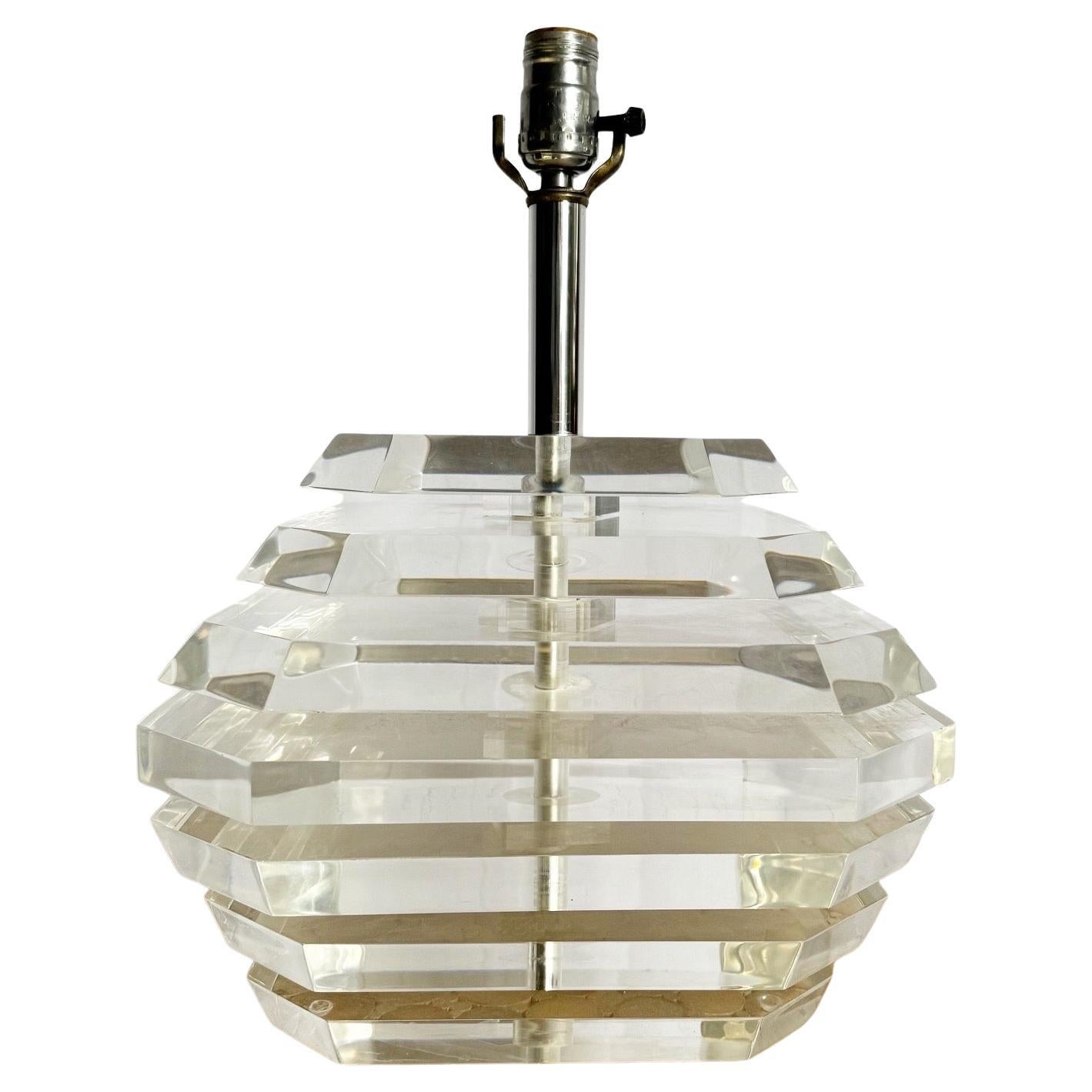 Introducing a Postmodern Chunky Stacked Lucite Table Lamp, featuring a bold geometric design with clear stacked Lucite blocks. This eye-catching lamp combines sleek modern style with functional lighting, making it a standout piece for contemporary