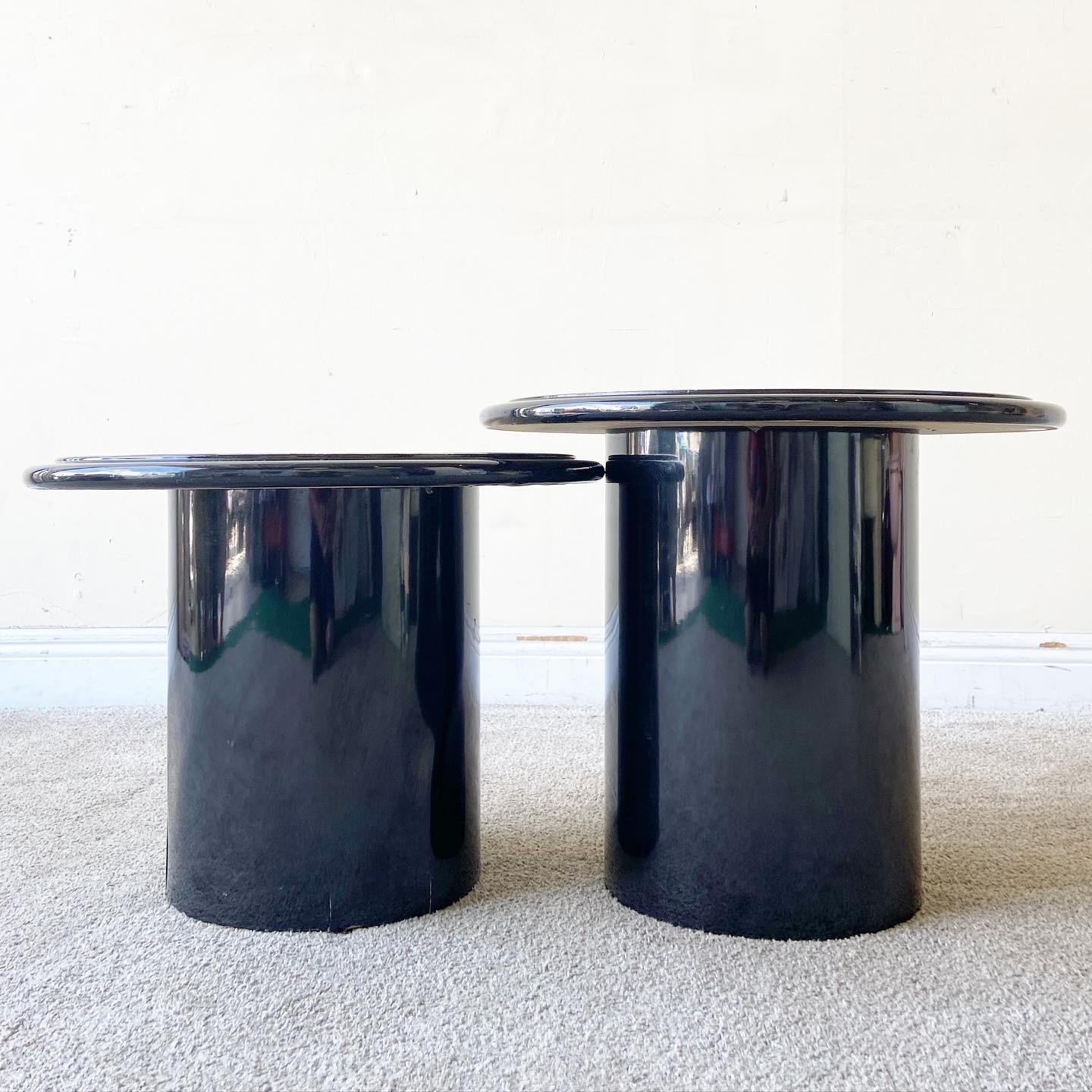 Incredible pair of postmodern/deco mushroom side tables. Each feature a black lacquered body with an abstract colorful design on the epoxy top.

Small one:
20w x 20d x 15h