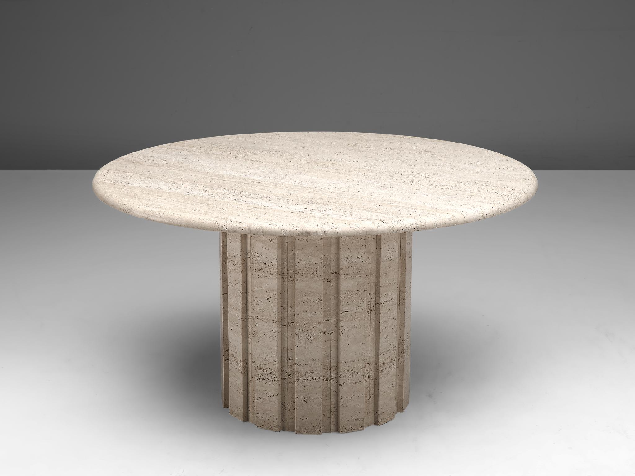Round dining table, travertine, Germany, 1970s

This archetypical center table is a skillful example of postmodern design. The table is executed in travertine. The round table features no joints or clamps and is architectural in its structure. The