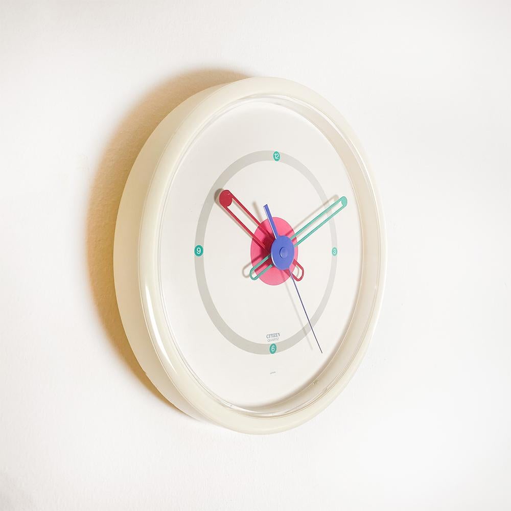 Postmodern Citizen Wall Clock, 1980's

Made in Japan.

white plastic.

Working correctly. The rear starting system works by moving the tab from start to stop and back to start to start it.

Measurements: 25x3 cm.
