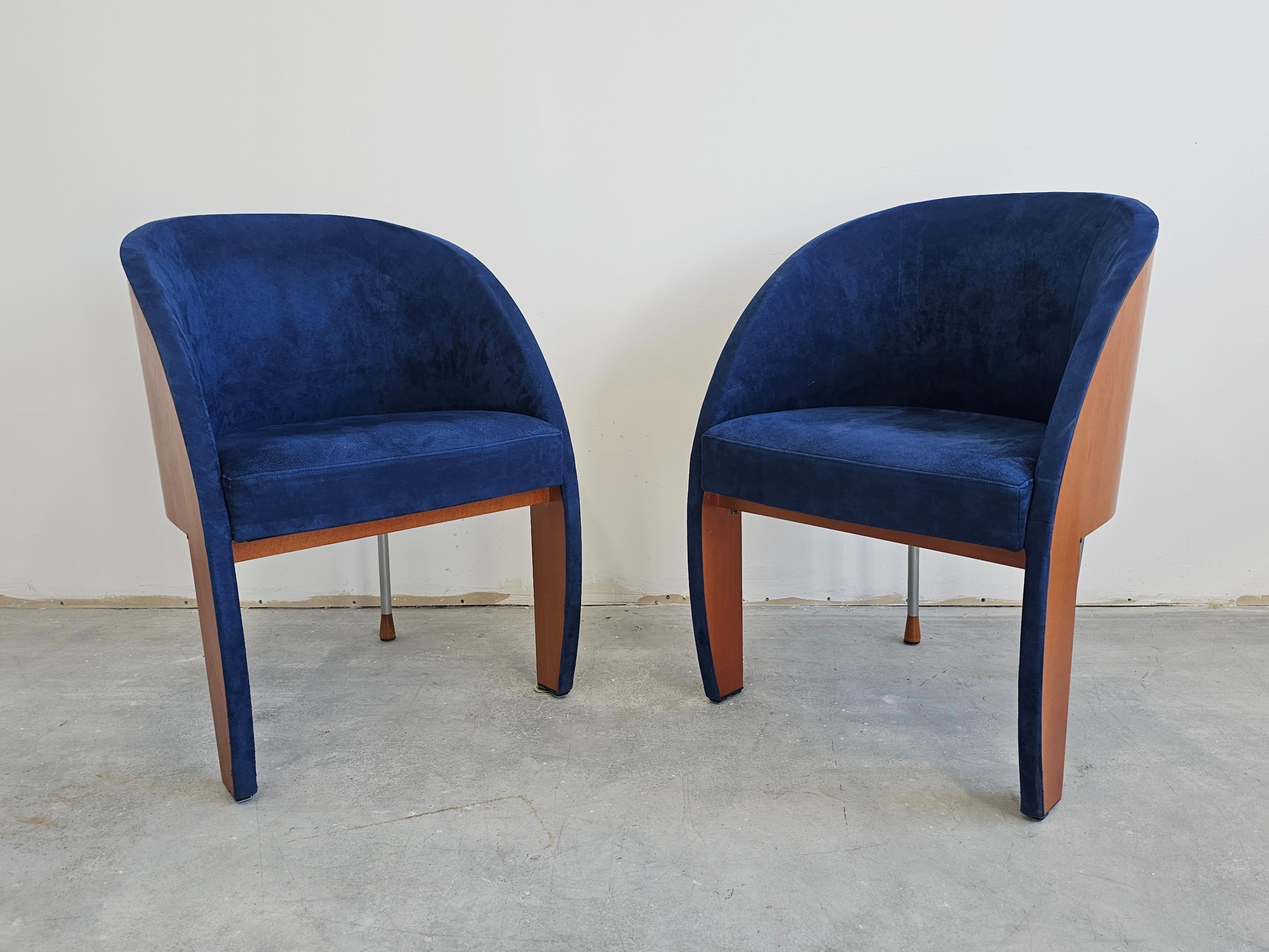 In this listing you will find a pair of very rare Postmodern side or club chairs manufactured by Ligne Roset. They feature barrel-like shape, upholstered in deep blue velvet and done in beech. Made in France in 1980s.

Good vintage condition with