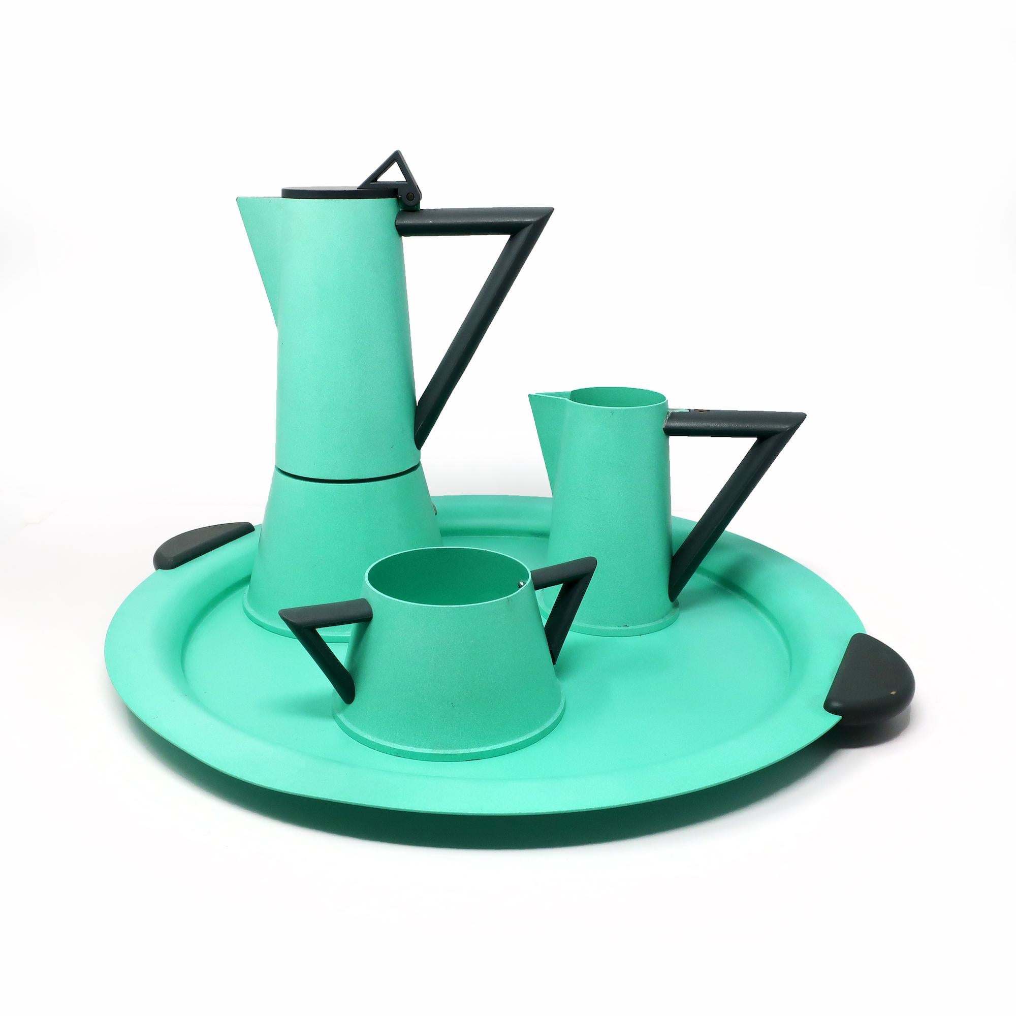 A quintessentially postmodern and very rare coffee set designed by the Memphis Milano master, Ettore Sottsass, for Lagostina's Accademia lin in the 1980s. Made in Italy, this set includes a metal stovetop espresso pot, milk pitcher, sugar bowl, and