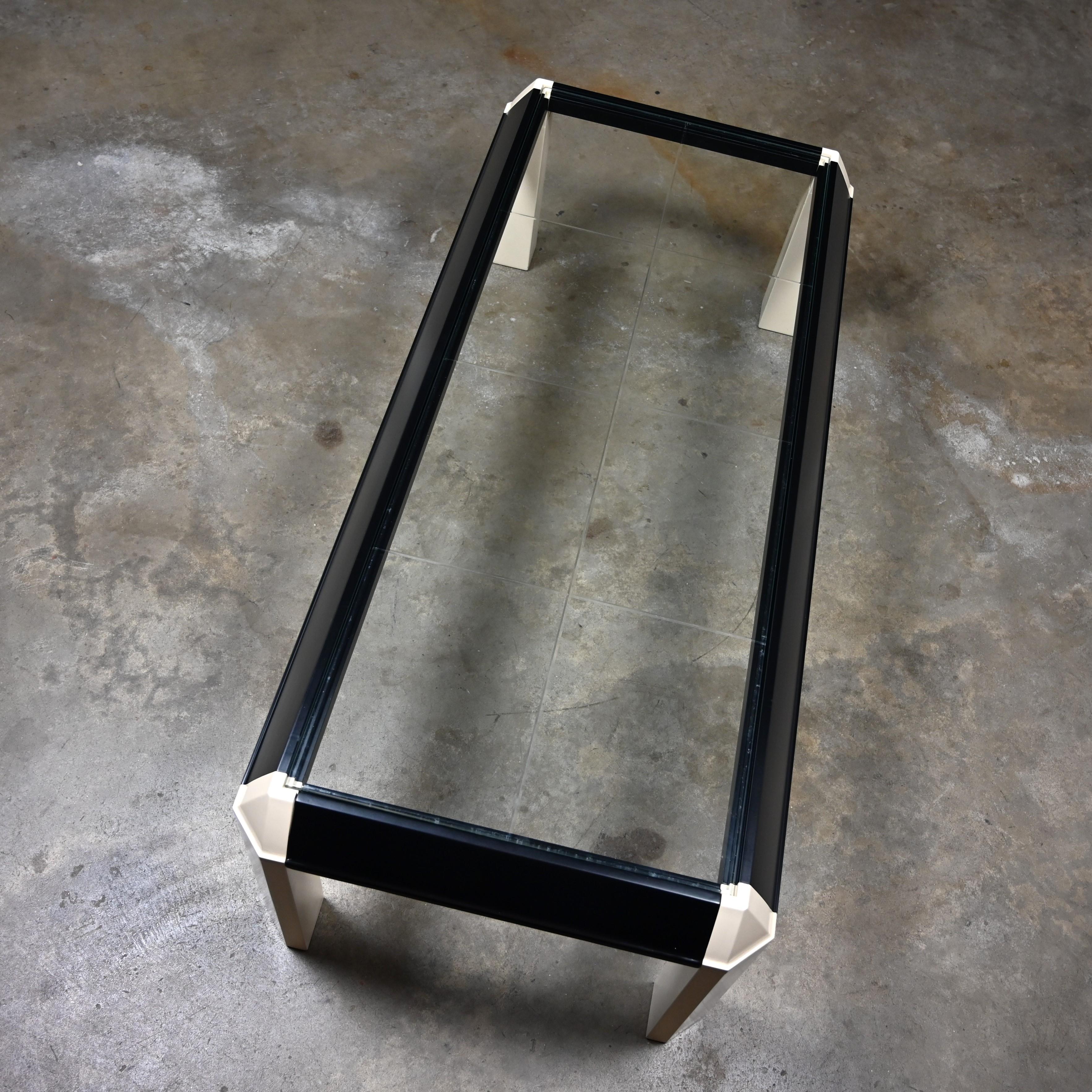 Postmodern Coffee Table Black Painted Frame Off White Trapezoid Legs Glass Top In Good Condition For Sale In Topeka, KS