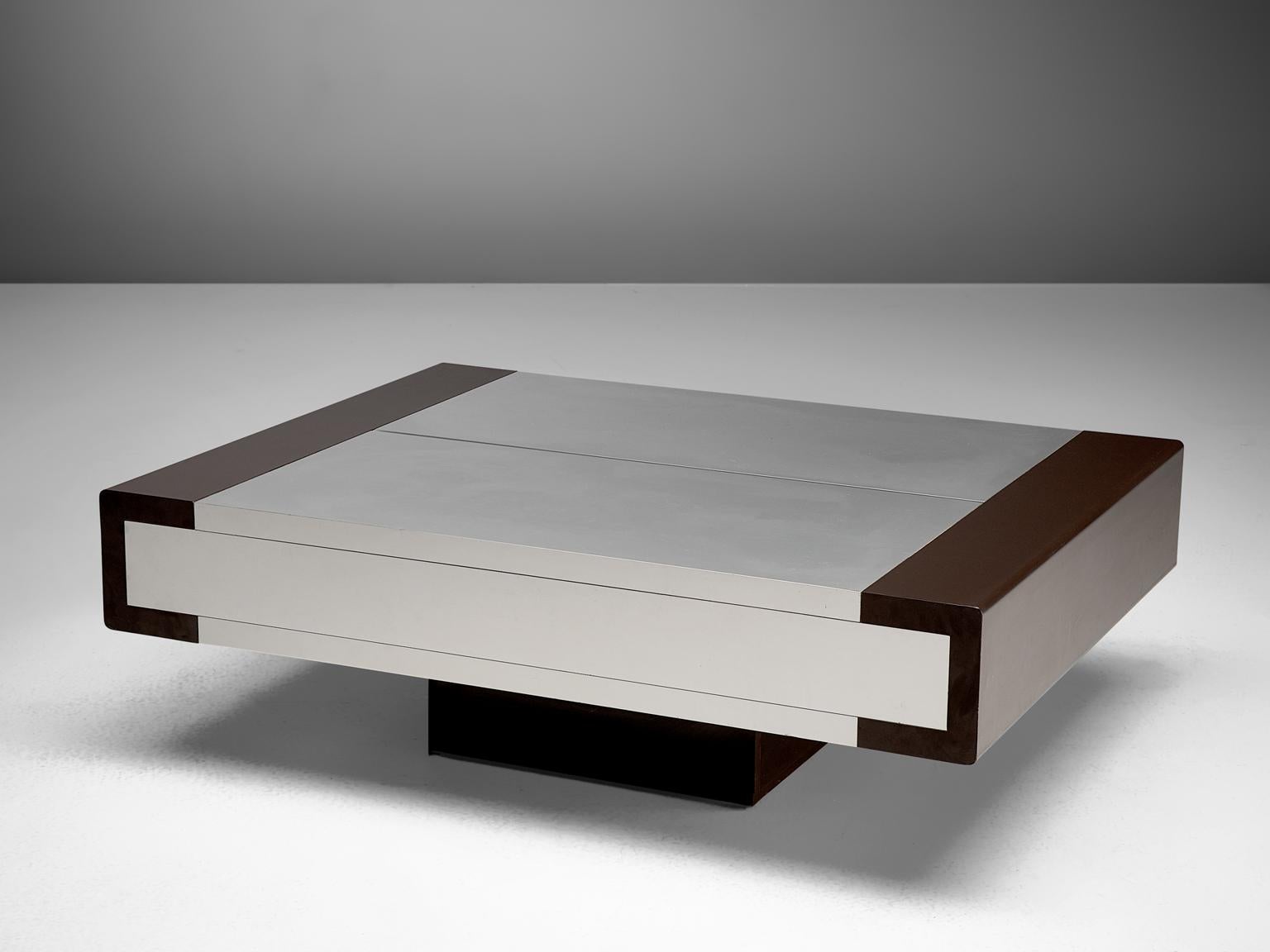 Coffee table, brushed aluminium, Europe, 1970s

This cubist shaped coffee table is executed in strong and materials as brushed aluminium. The table is finished with dark leatherette on the sides. The table top is extendable, in which appears a