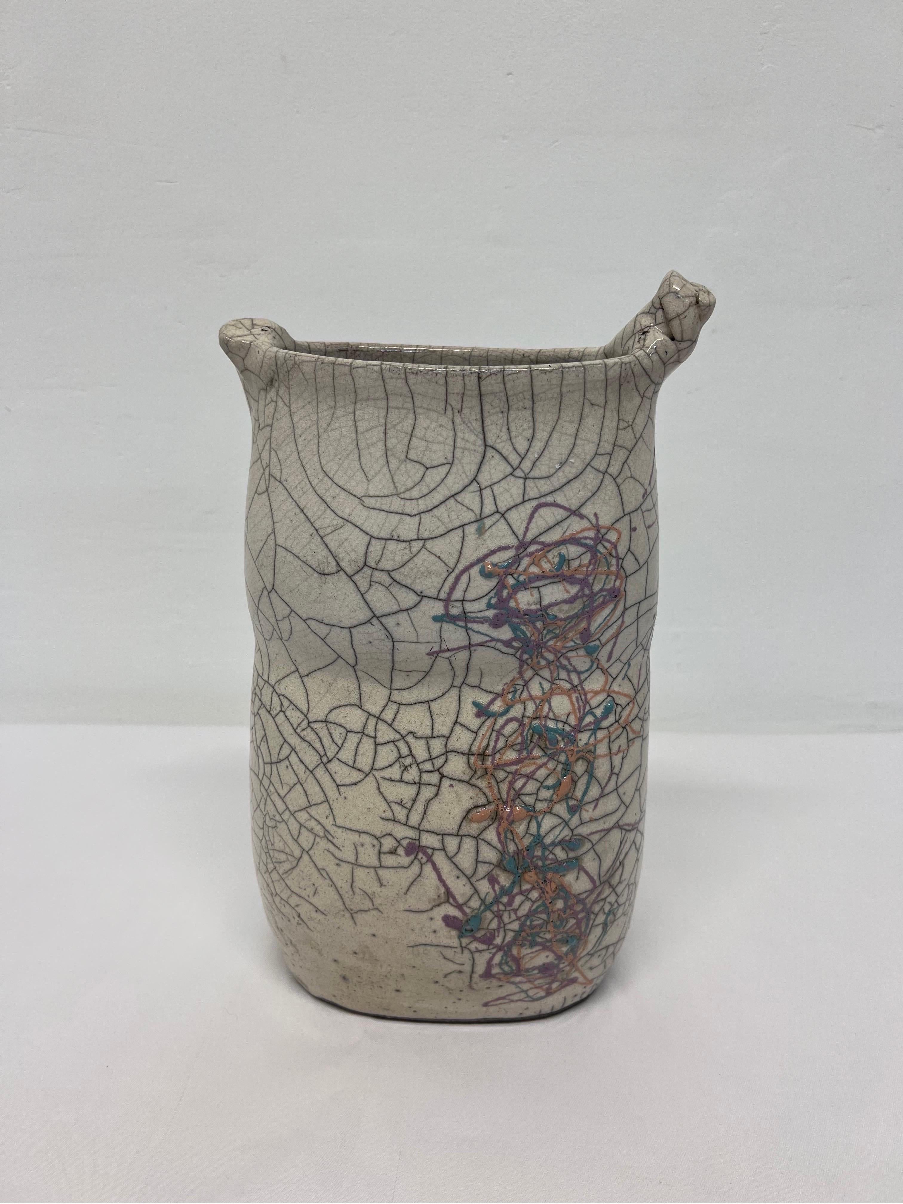 Crackled glaze studio pottery vase with artistic design from the 1980s. Signed by artist.