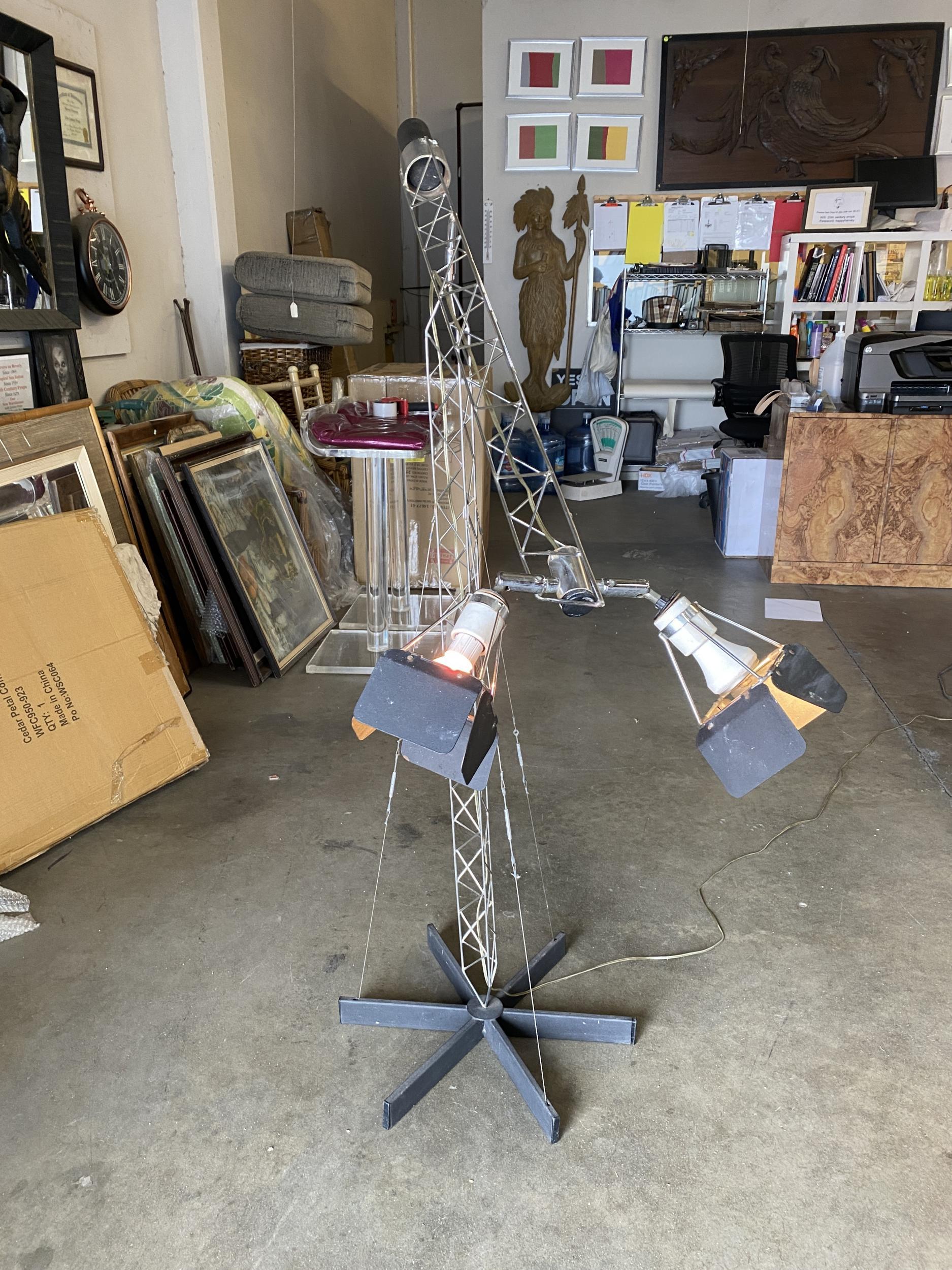 This large-scale, 1970s Curtis Jere floor lamp is shaped like a crane with a counter balanced arm which terminates with two-light fixtures. The lamp is adjustable and will undoubtedly make a strong statement in any setting.

Signed and dated, 