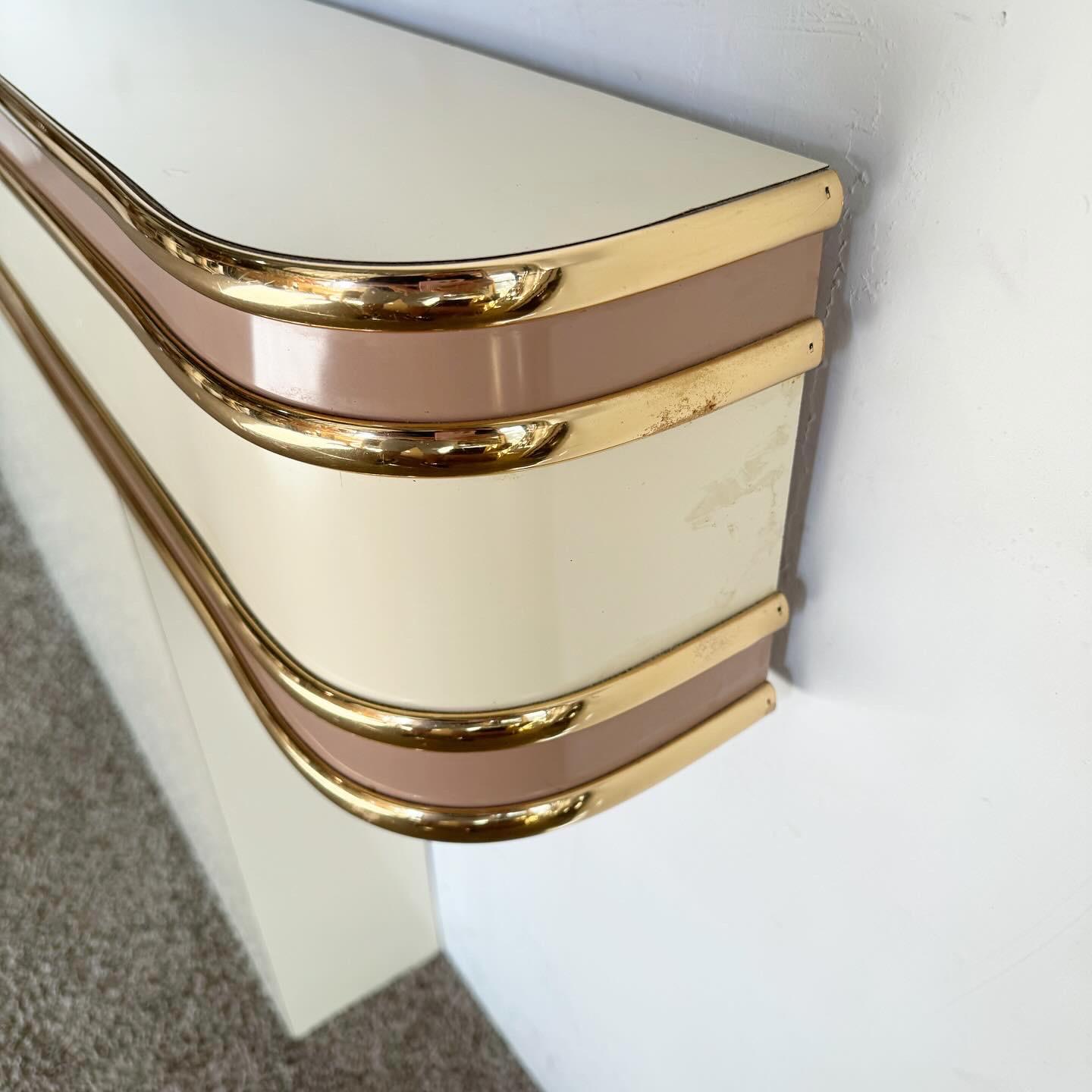 Embrace 80s elegance with the Postmodern Pink & Gold Queen Headboard. Its bold cream and pink lacquer, accented with gold trim, offers a vibrant, luxurious statement for your bedroom. The headboard's unique design and color scheme make it an ideal