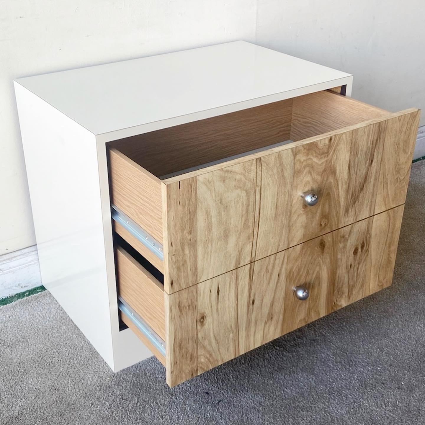 Exceptional postmodern nightstand/end table. Features a cream lacquer and Woodgrain laminate with 2 spacious drawer. Each drawer has a chrome knob.

Additional information:
Material: Wood
Color: Cream
Style: Postmodern
Time Period: