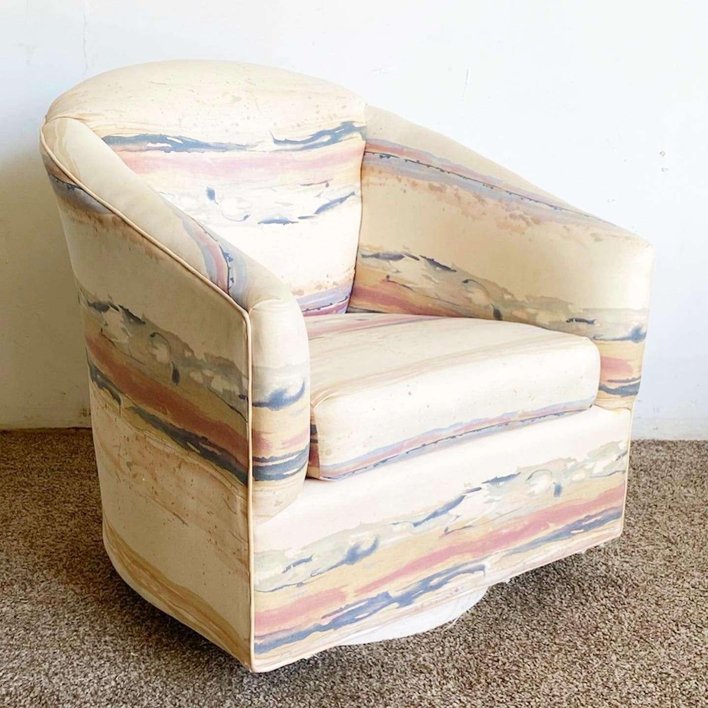 Incredible vintage postmodern swivel barrel chair. Features a cream fabric with blue and pink streaks.

Seat height is 17.5 in