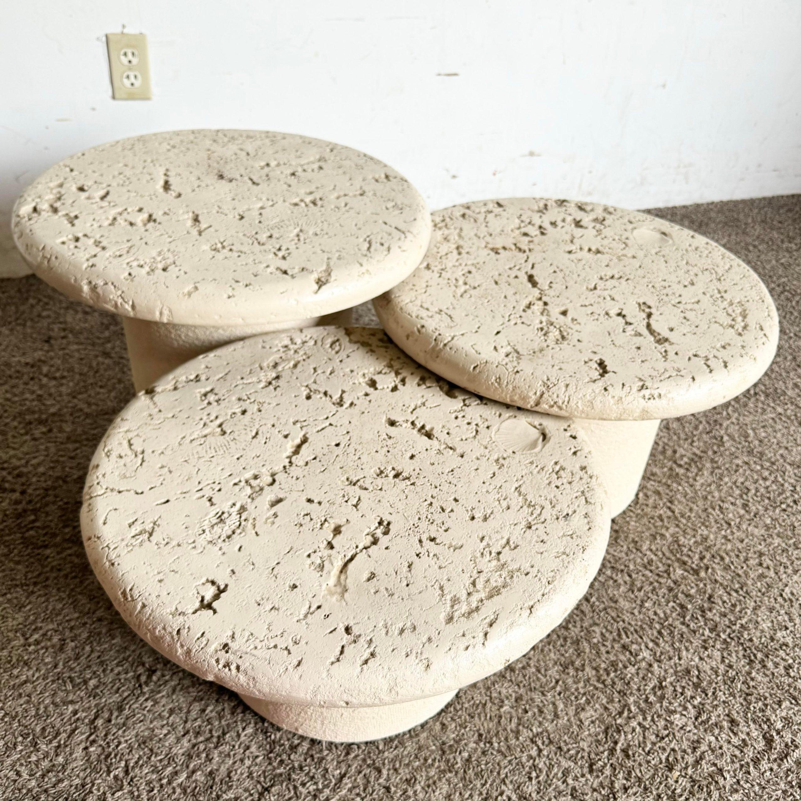 Enhance your living space with this set of 3 Postmodern Faux Coral Nesting Tables. Featuring a unique circular mushroom design, these tables blend functionality with artistic flair. The cream faux coral finish adds texture and visual interest,