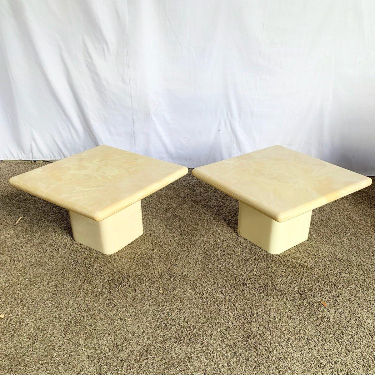Postmodern Cream Faux Marble Side Tables bring sculptural elegance and versatile luxury to interiors with refined marble-look sophistication.
 

 Some yellowing from age as can be seen in the photos.
 

 We sell items as acquired, without restoring