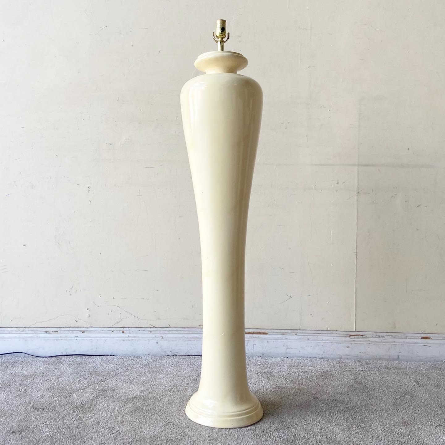 Exceptional postmodern ceramic floor lamp. Features a cream lacquered finish.
 