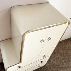 Postmodern Cream Lacquer Laminate Sculpted Waterfall Armoire With Gold Trim