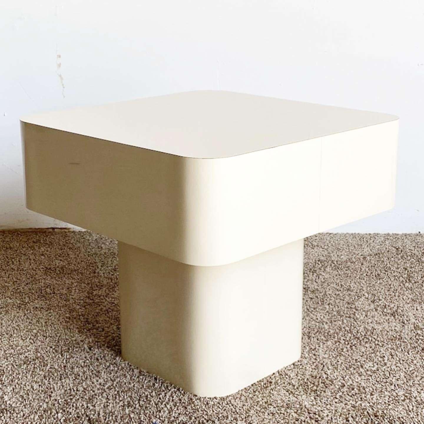Exceptional vintage postmodern mushroom side table. Features a cream lacquer laminate and a square top with rounded edges.
