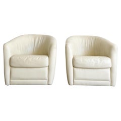 Postmodern Cream Leather Swivel Chairs by Natuzzi, a Pair