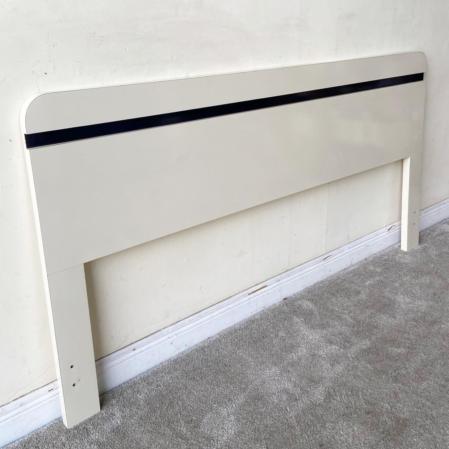 Incredible postmodern king size headboard. features a cream and navy blue lacquer laminate.