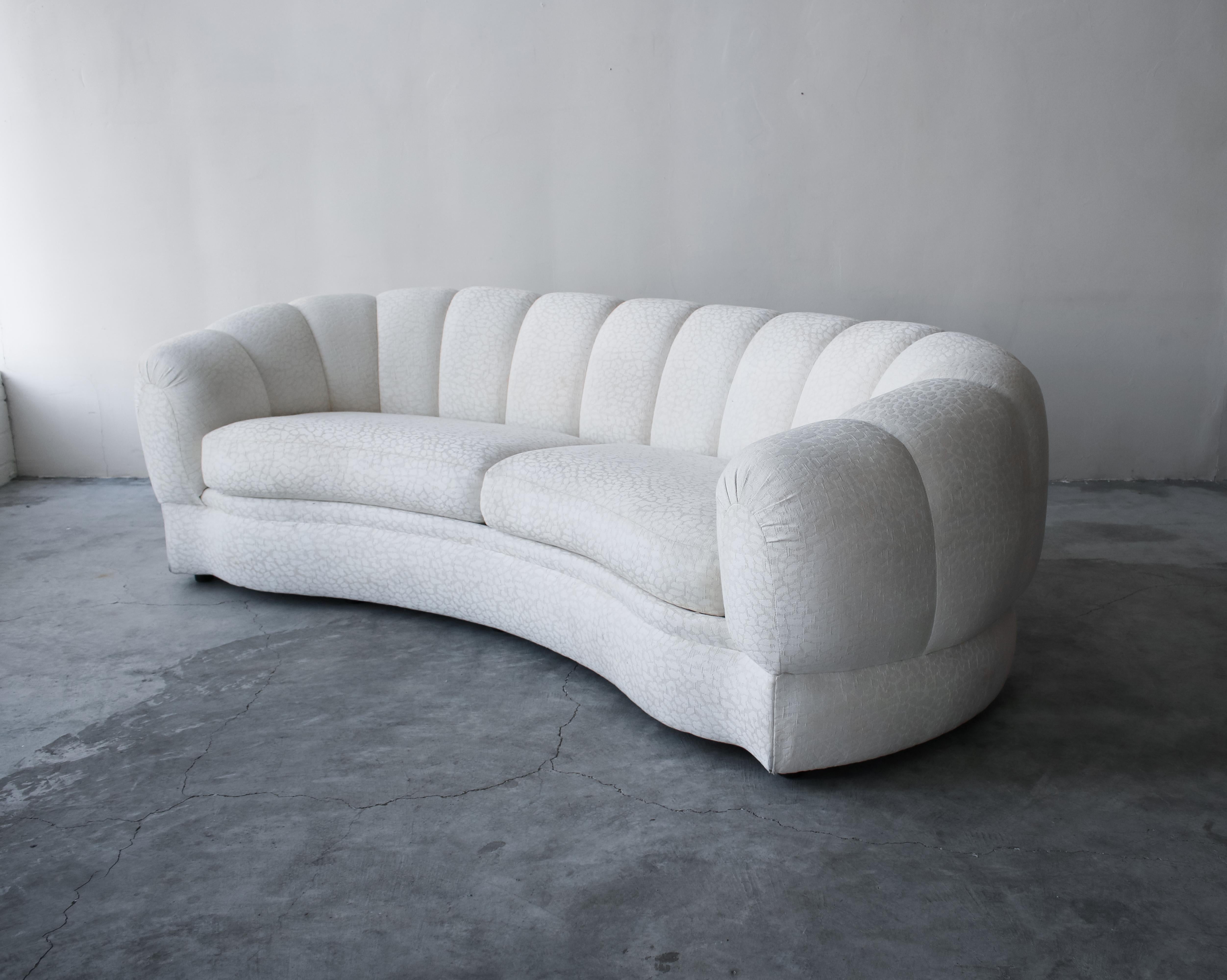 Incredible curved Postmodern sofa with the perfect channeling. This beauty truly has lines and curves worth coveting. It's gorgeous from the front but the backside is it die for. I can't wait to see this beauty redone. The sofa also features a