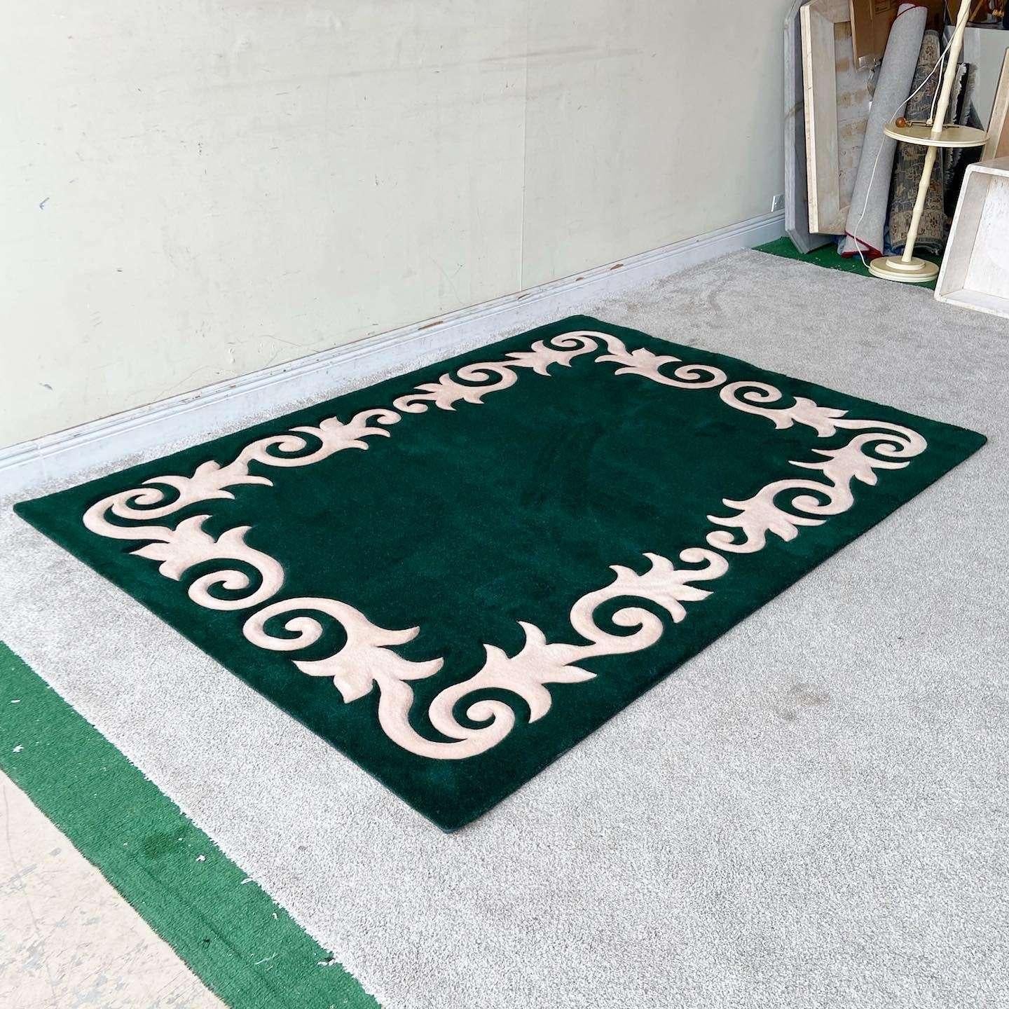 Exceptional vintage postmodern rectangular area rug. Features a Dark green with the outer trim bordered by a light pink vining the edge of the rug.

Rug 7
