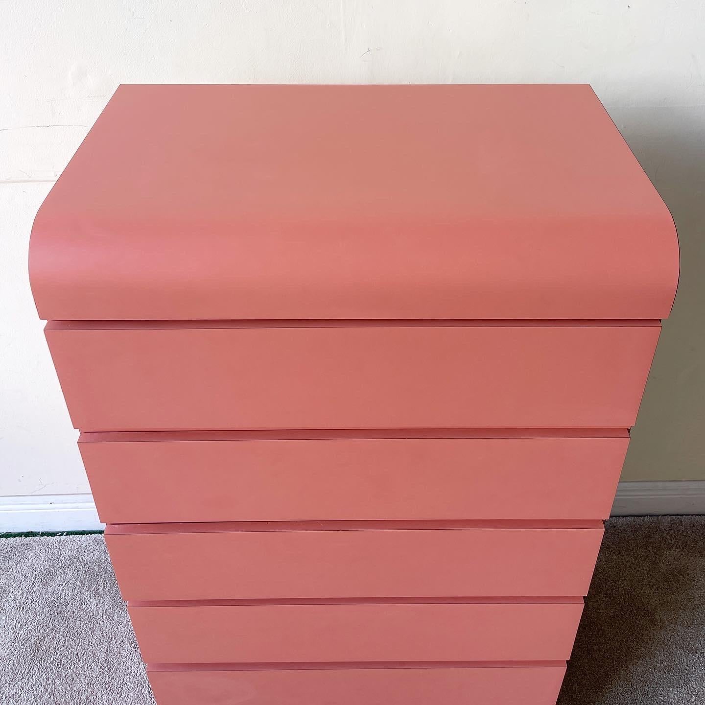Incredible postmodern waterfall highboy dresser. Features a hot dark pink laminate and 6 spacious drawers.
 