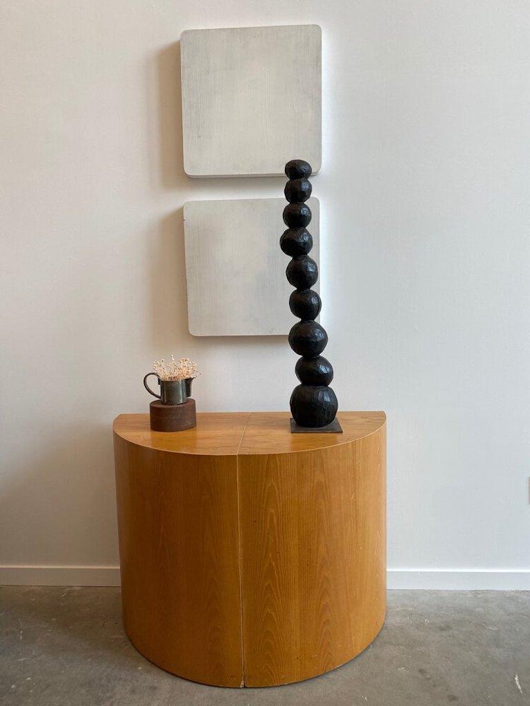 A Postmodern demi-lune console table w/ a oak wood veneer. Modern look of a designer’s eye.